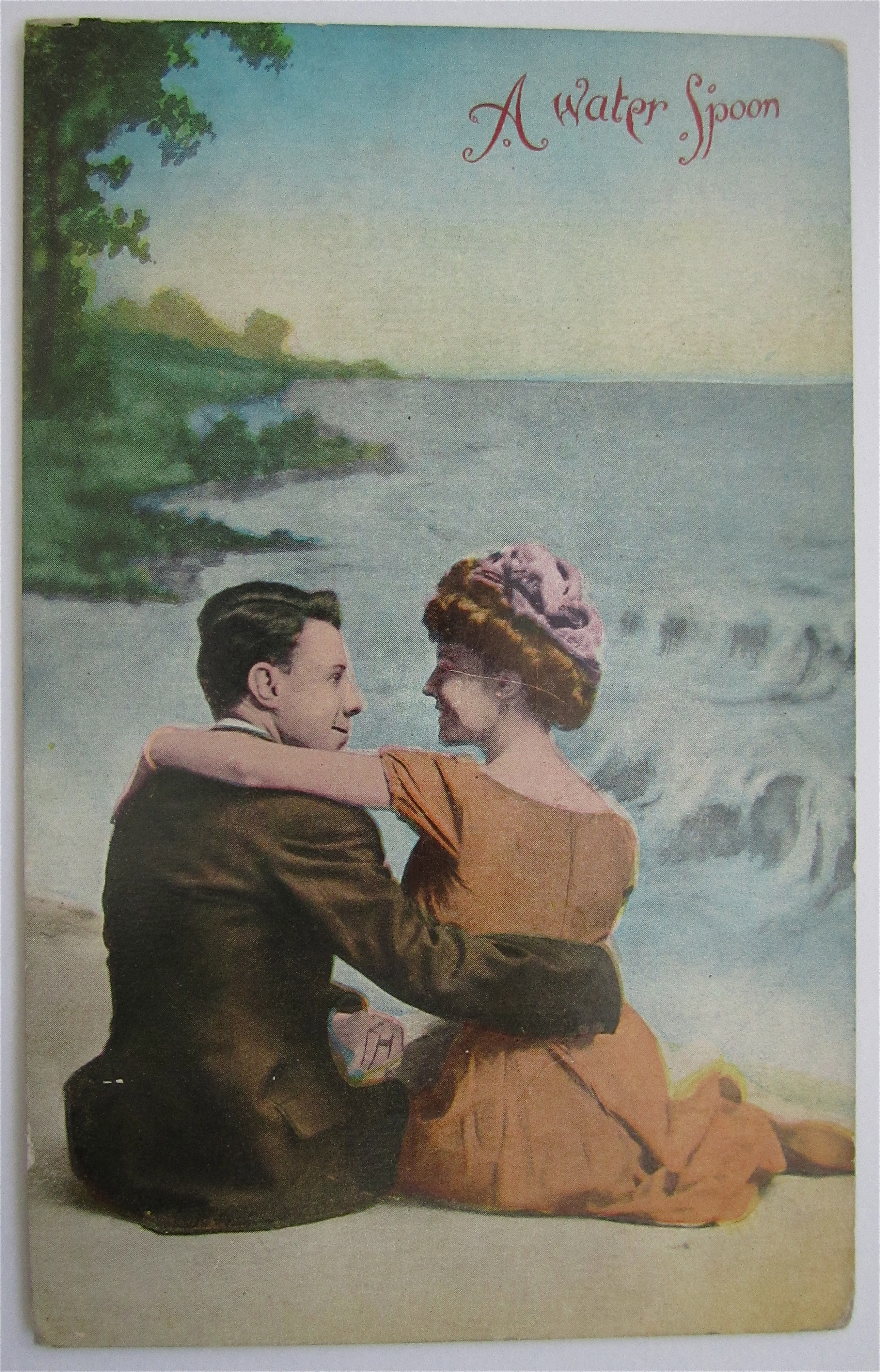 Man And Woman Sitting On Beach Postcard
