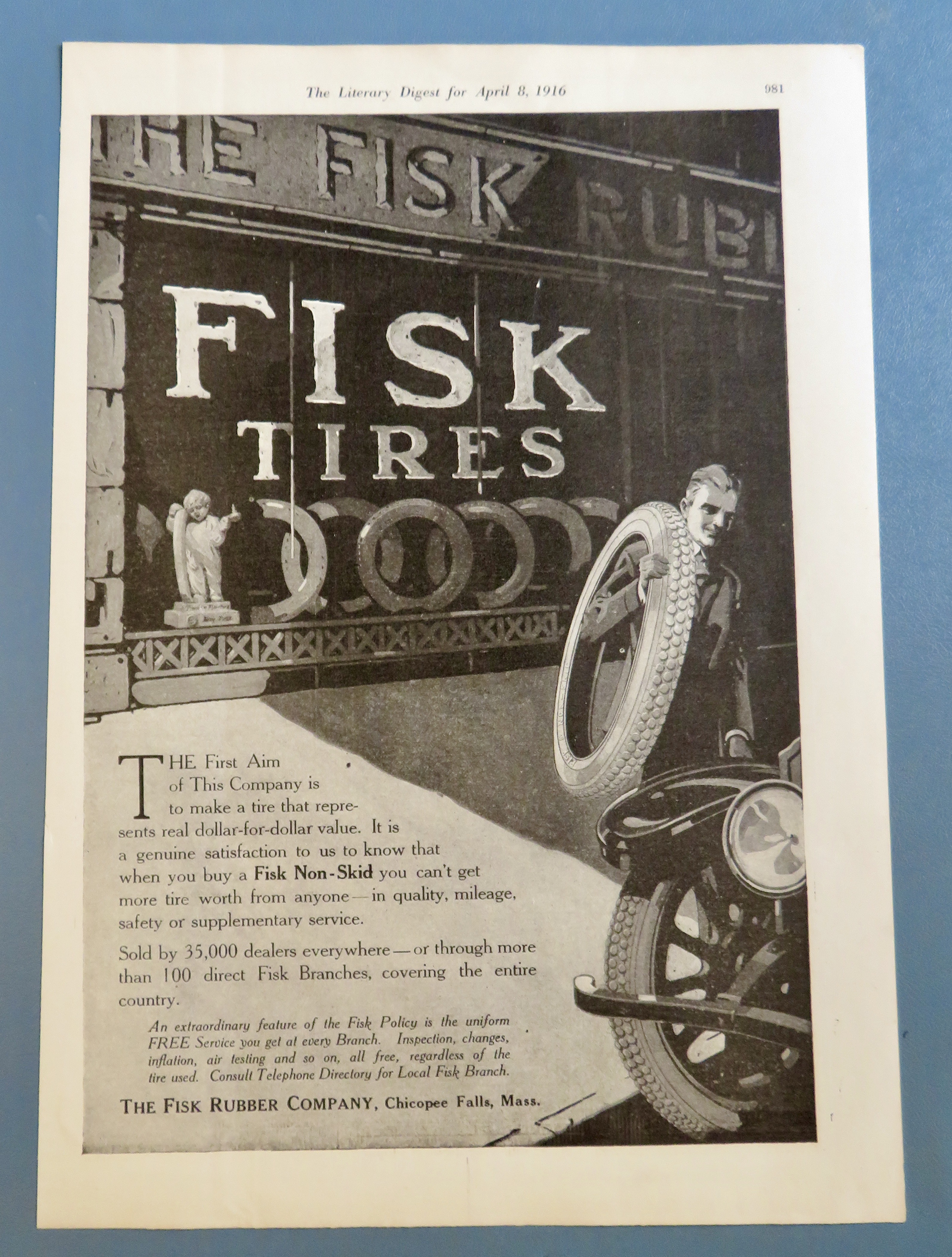 1916 Fisk Tires with Man Carrying a Tire