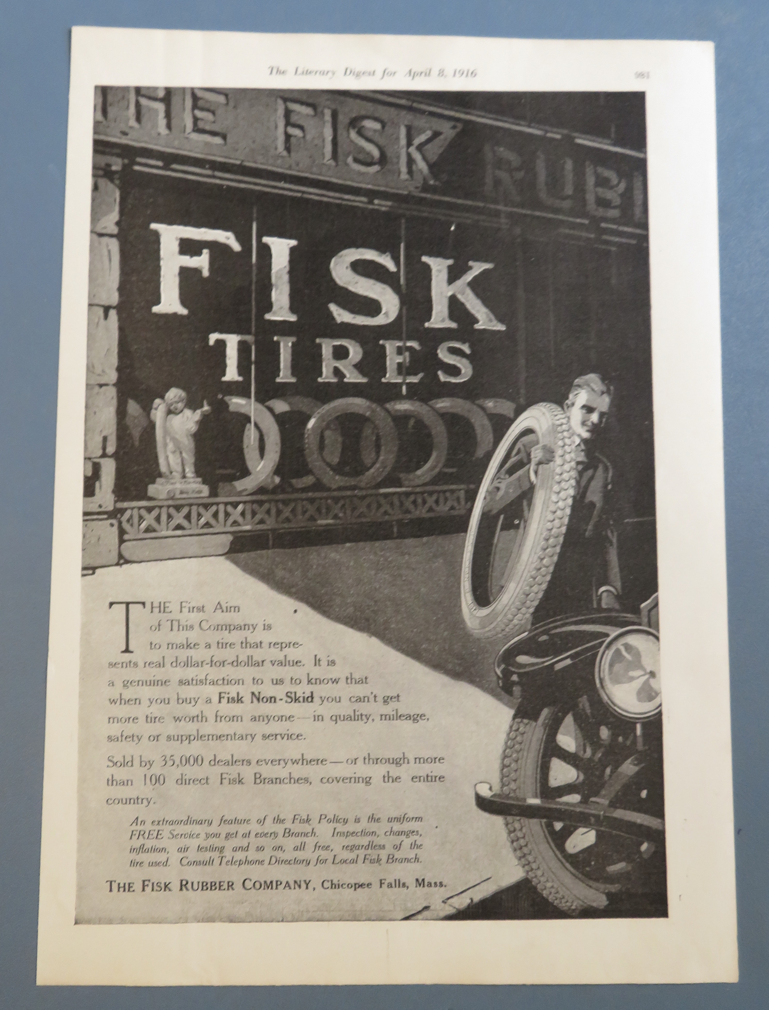 1916 Fisk Tires with Man Carrying a Tire