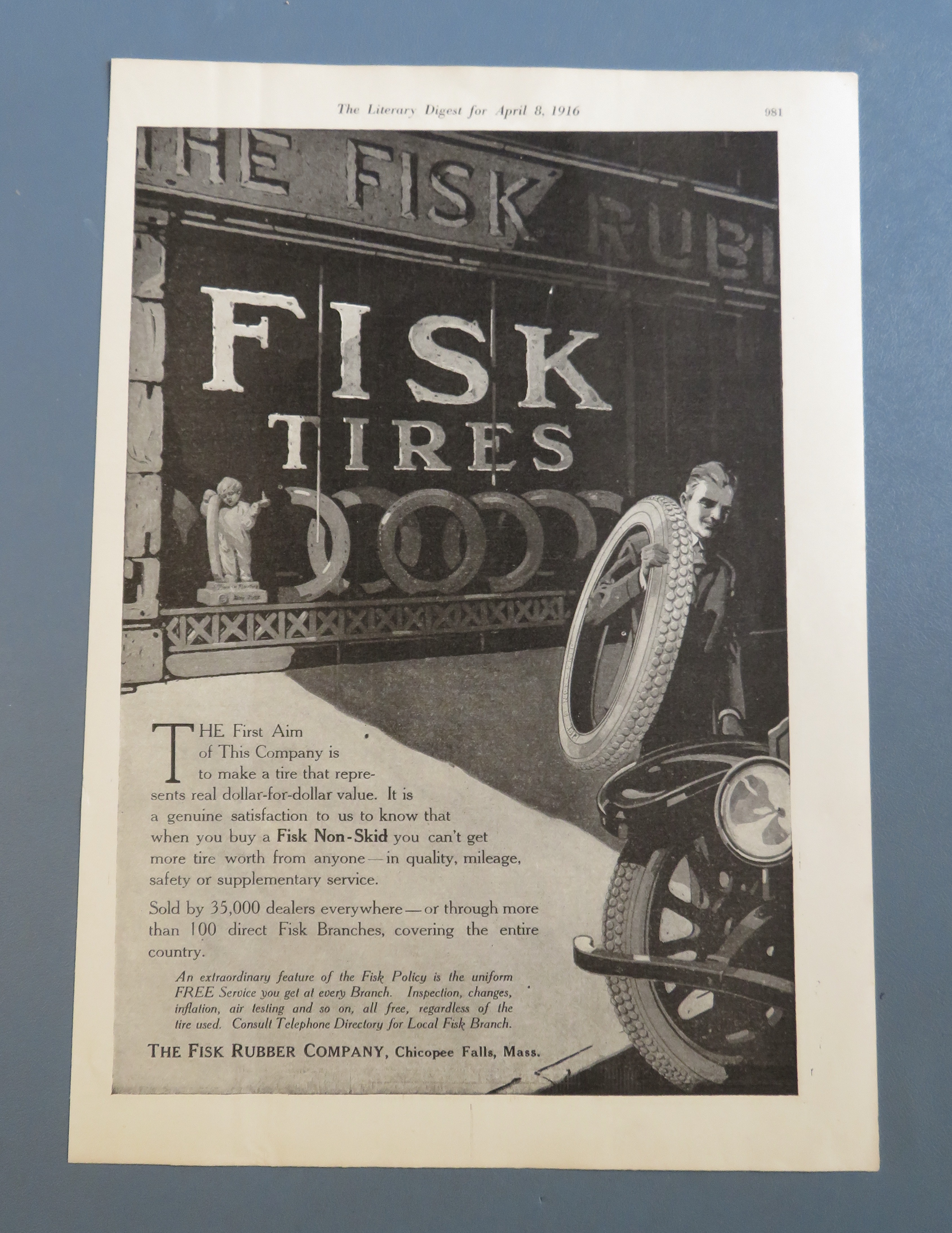 1916 Fisk Tires with Man Carrying a Tire
