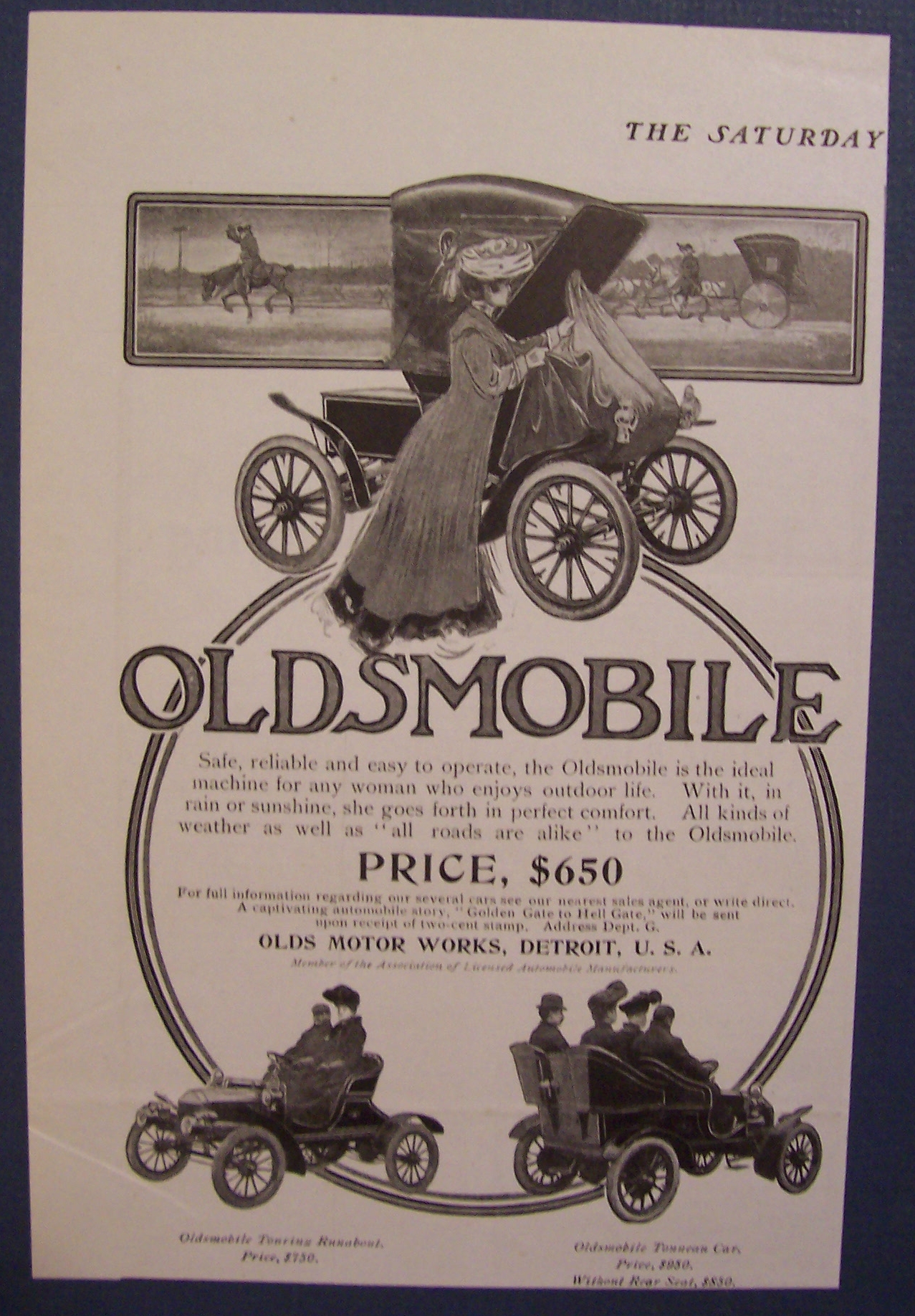 1904 Oldsmobile with a Woman Along Side the Car