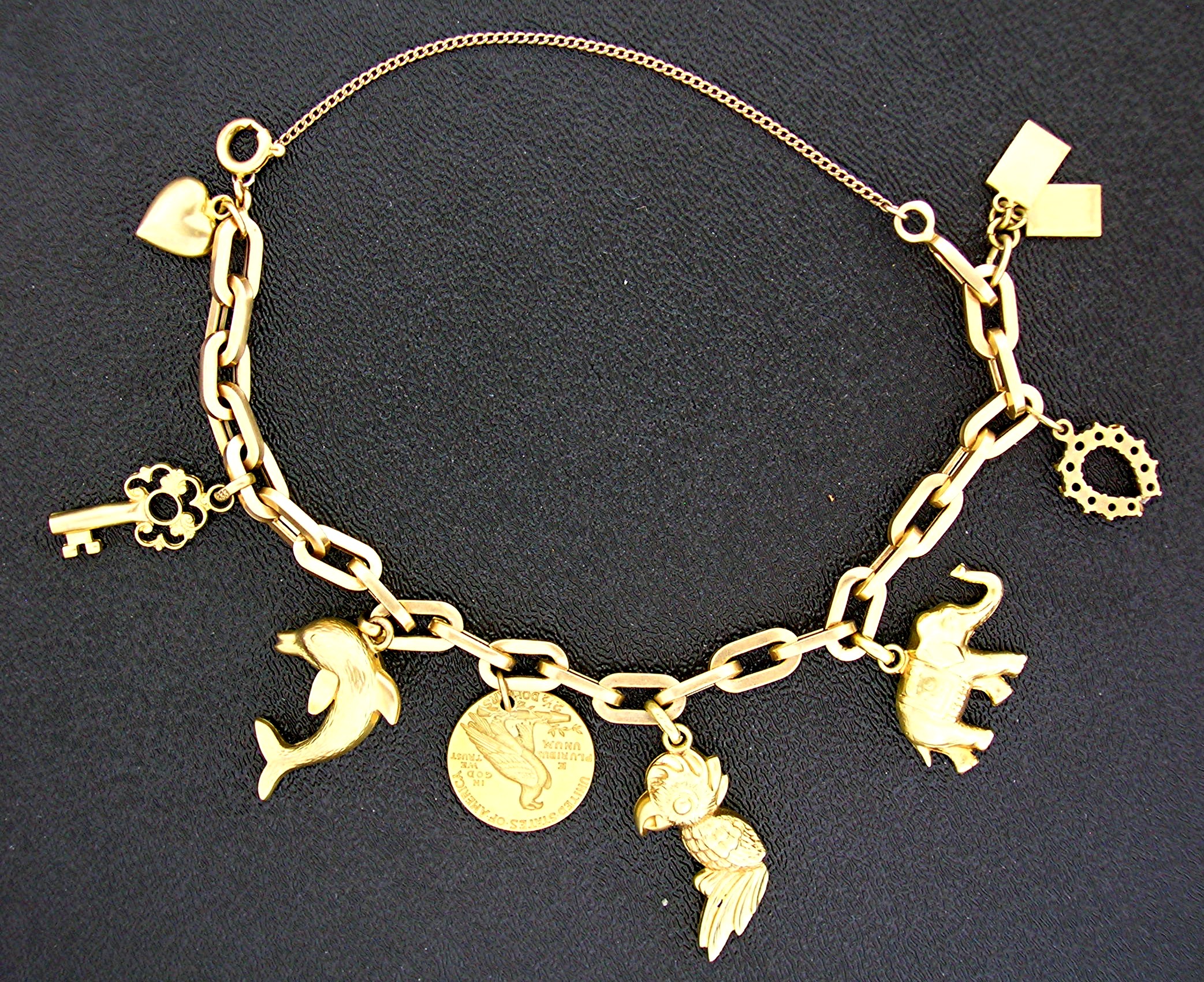 Bracelet  14K Gold 9 CHARM 22.1 grams