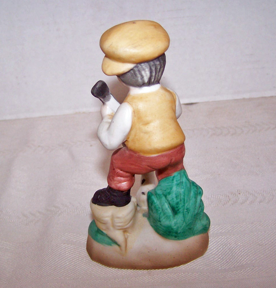 Bisque Boy Figurine with his Dog, as the Boy Plays