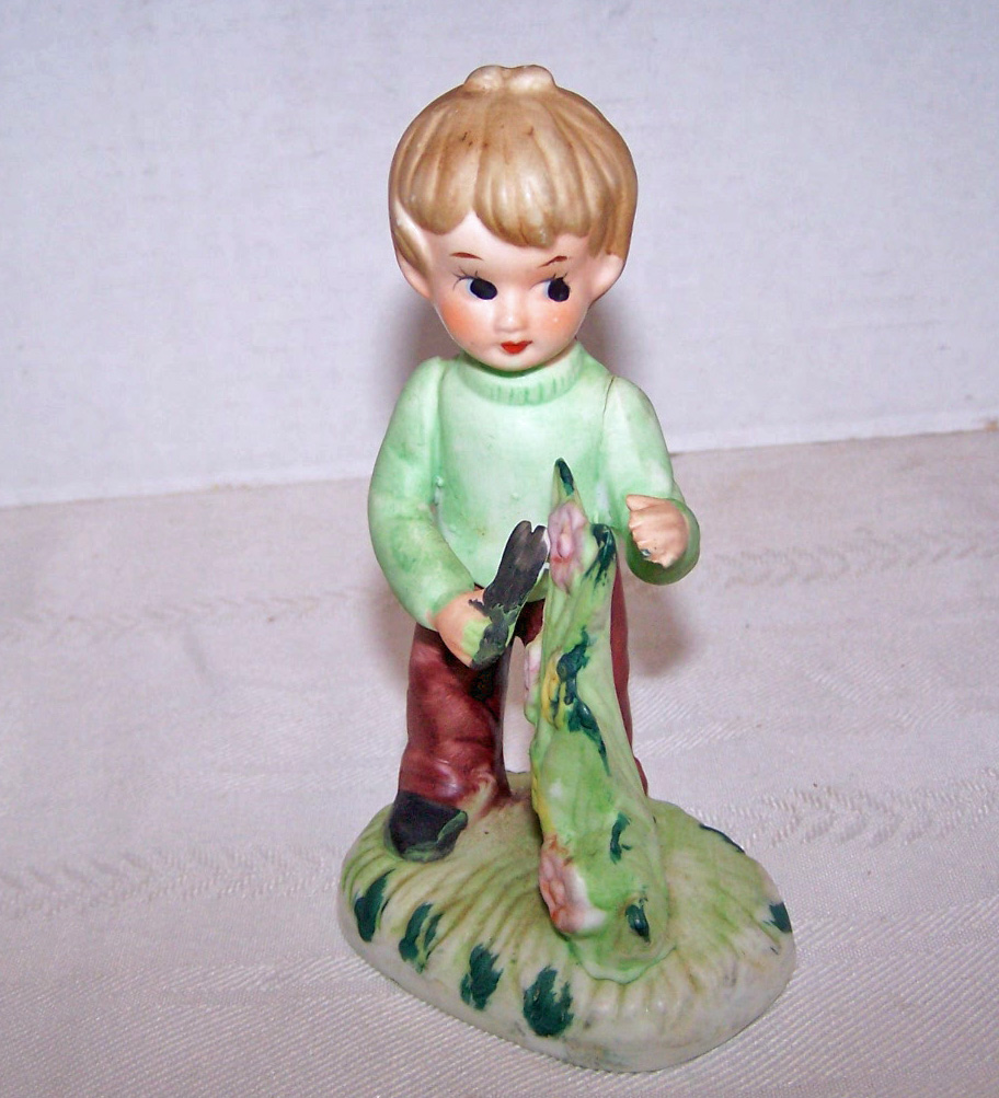 Bisque Boy Figurine Holding Scissors Tending to Plant
