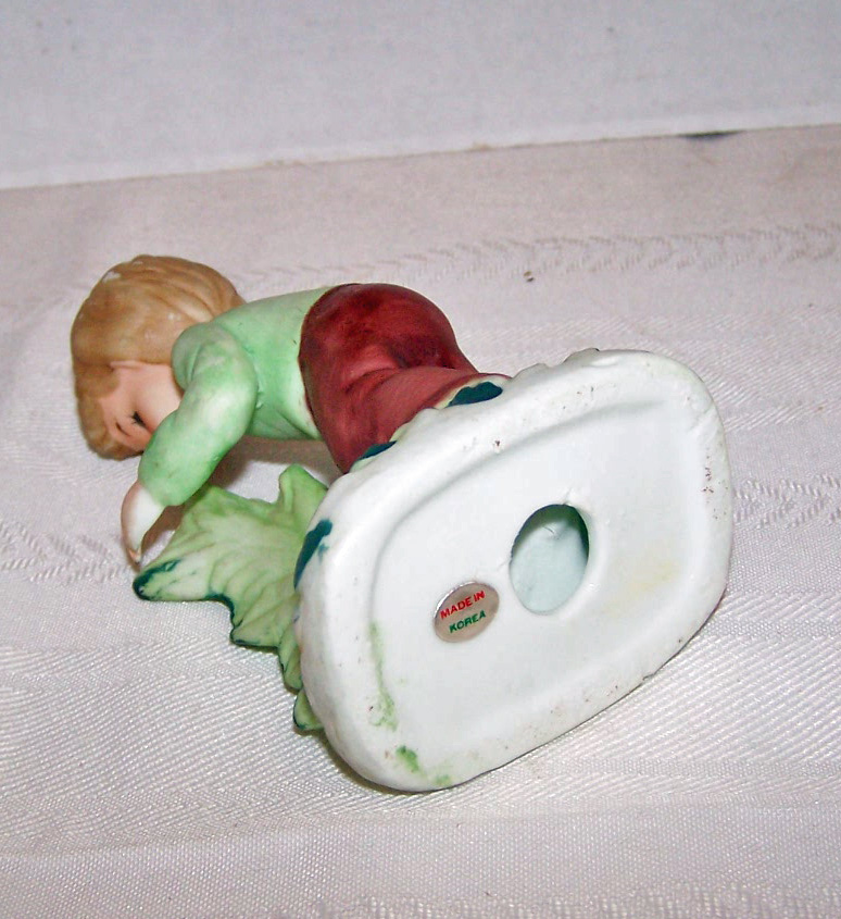 Bisque Boy Figurine Holding Scissors Tending to Plant