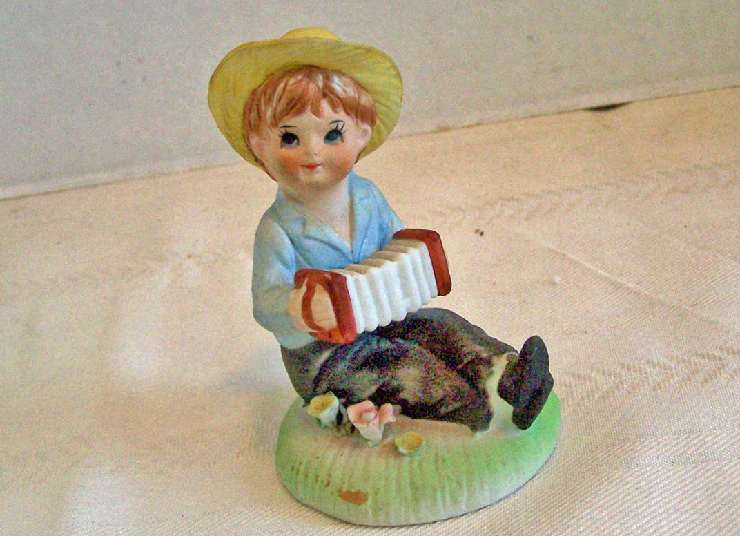 Bisque Boy Figurine Sitting & Playing the Accordion