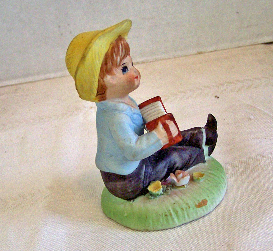 Bisque Boy Figurine Sitting & Playing the Accordion