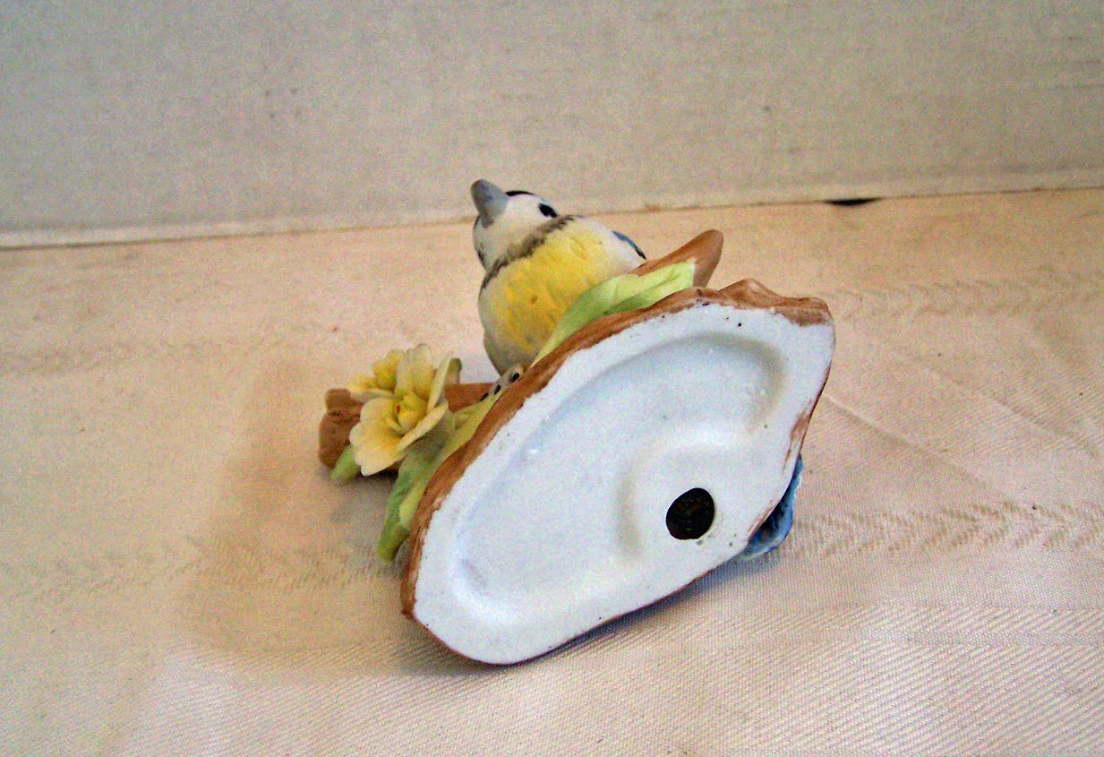 Bisque Bird Sitting on Branch with Flowers Figurine