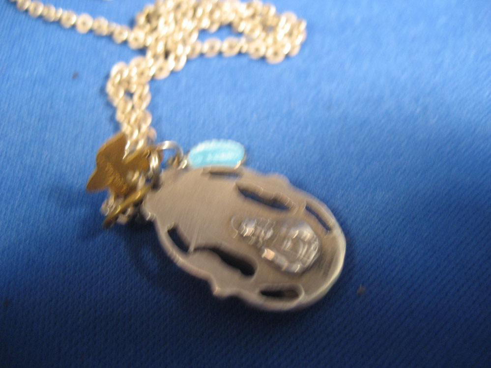 Metal of Mary with 2 charms