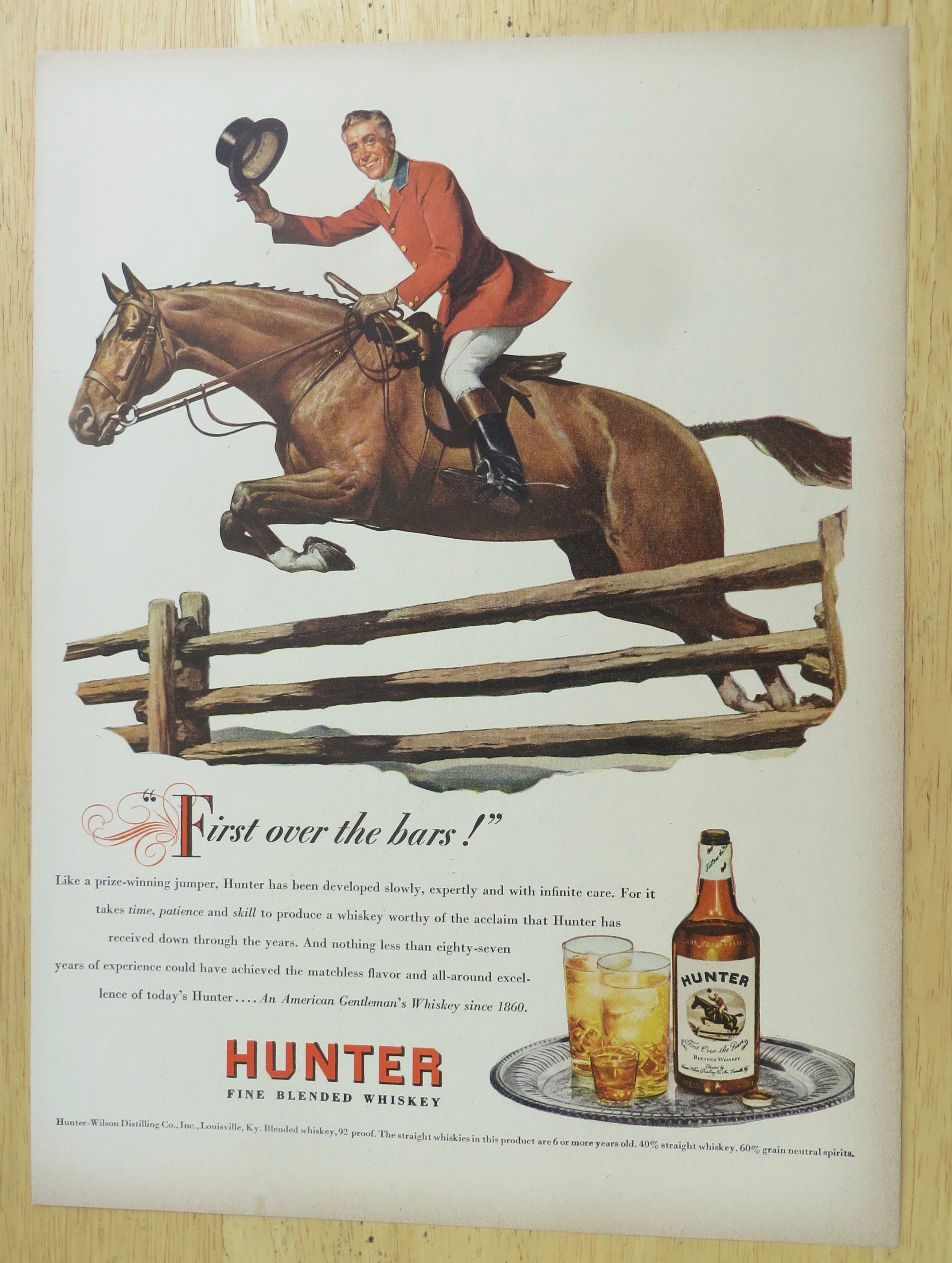 1947 Hunter Whiskey with Man Riding on a Horse