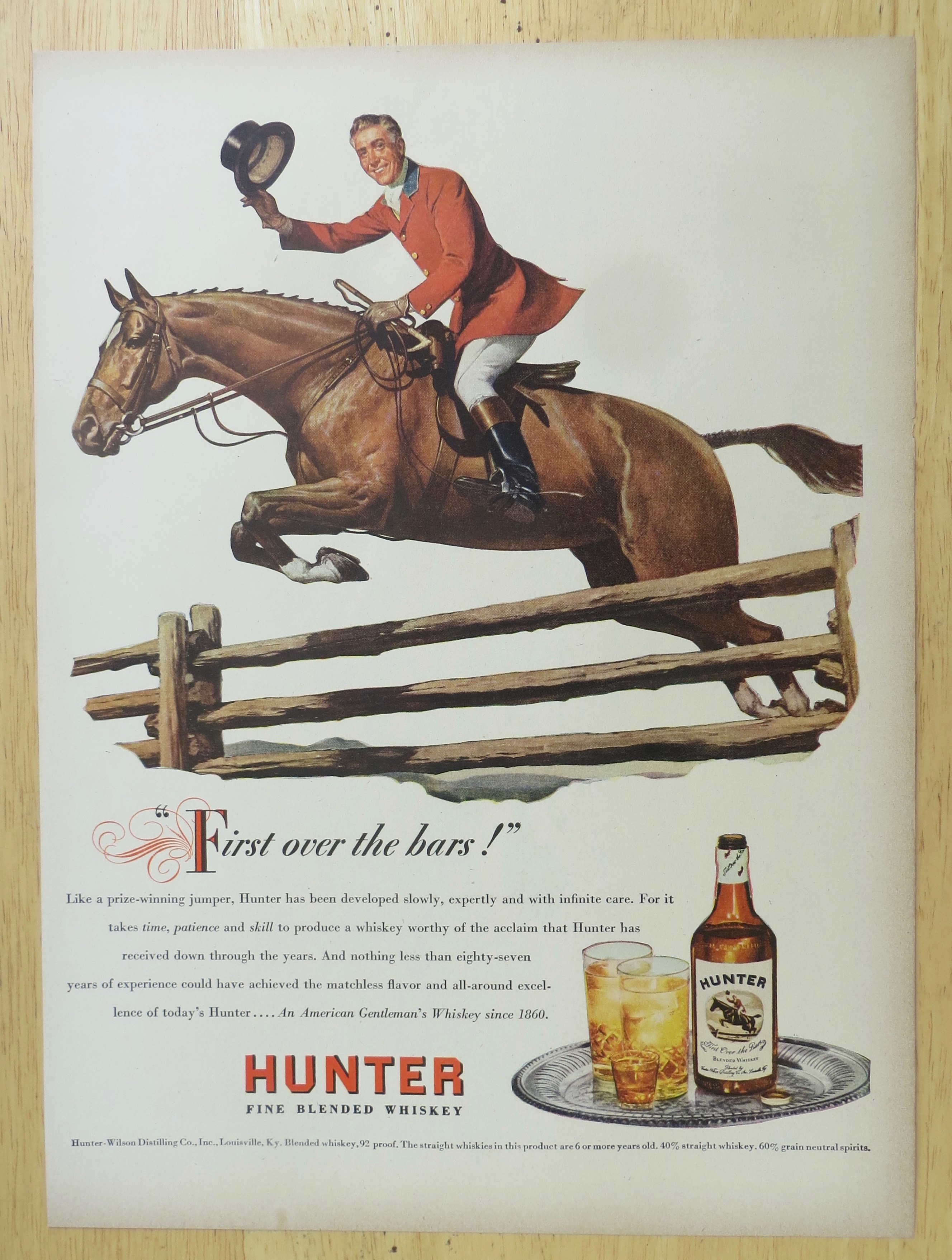 1947 Hunter Whiskey with Man Riding on a Horse