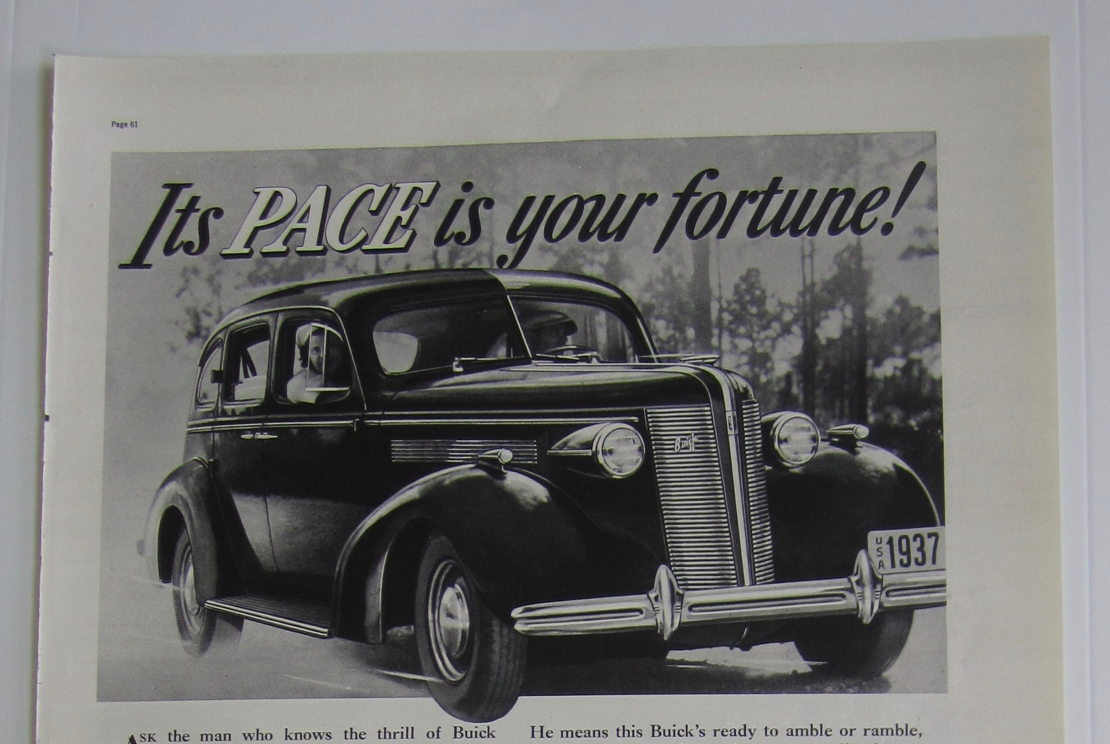 1937 Buick with a couple driving in Buick