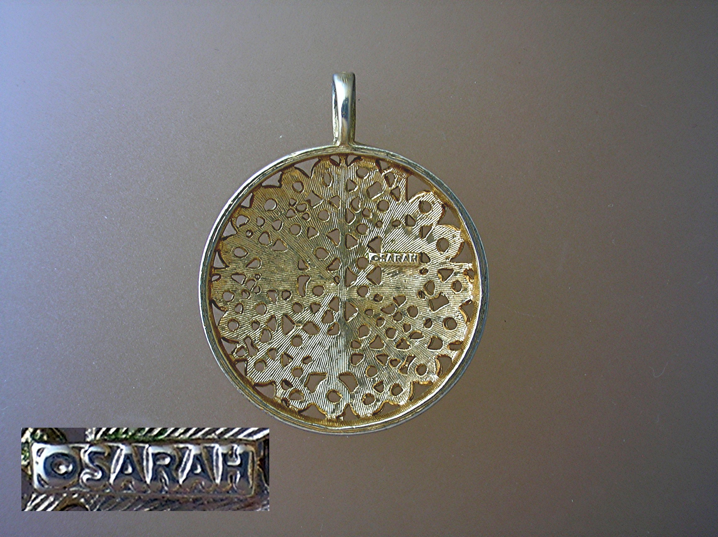 Sarah Coventry Goldtone Round Heavy Filigree Pendant  .