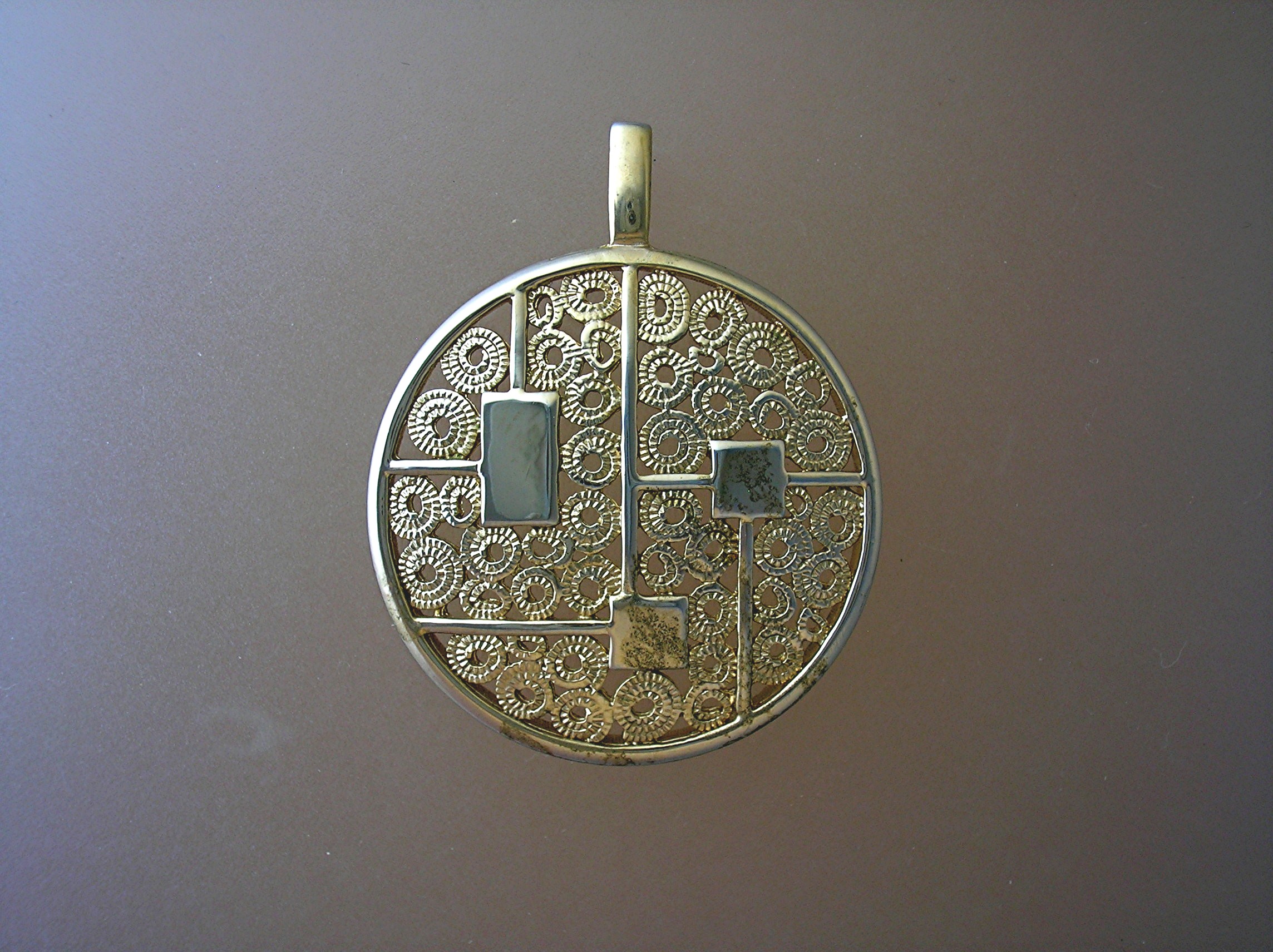 Sarah Coventry Goldtone Round Heavy Filigree Pendant  .