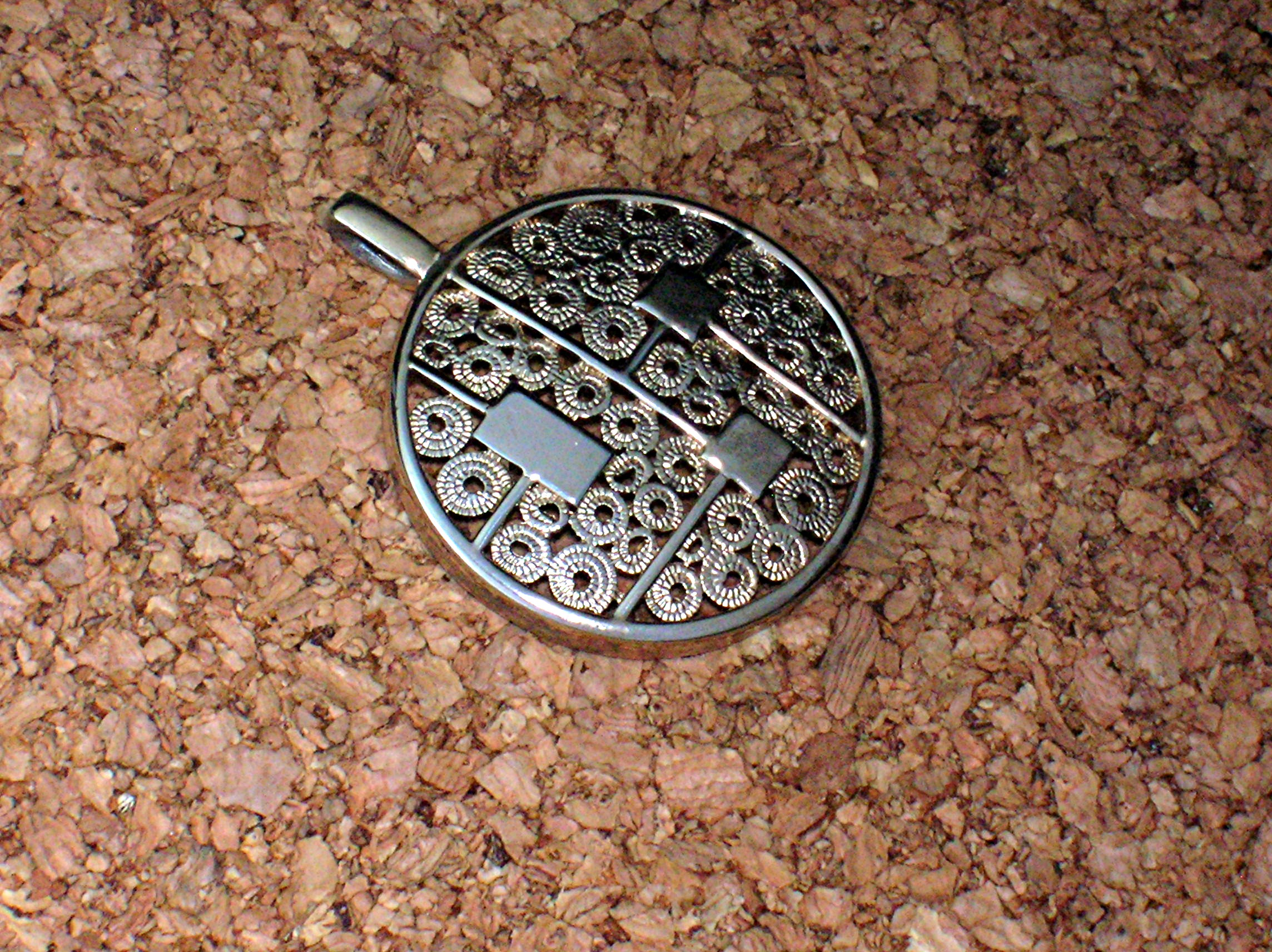 Sarah Coventry Goldtone Round Heavy Filigree Pendant  .