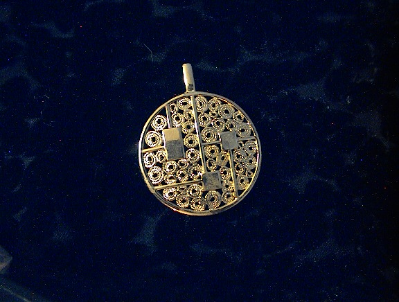 Sarah Coventry Goldtone Round Heavy Filigree Pendant  .