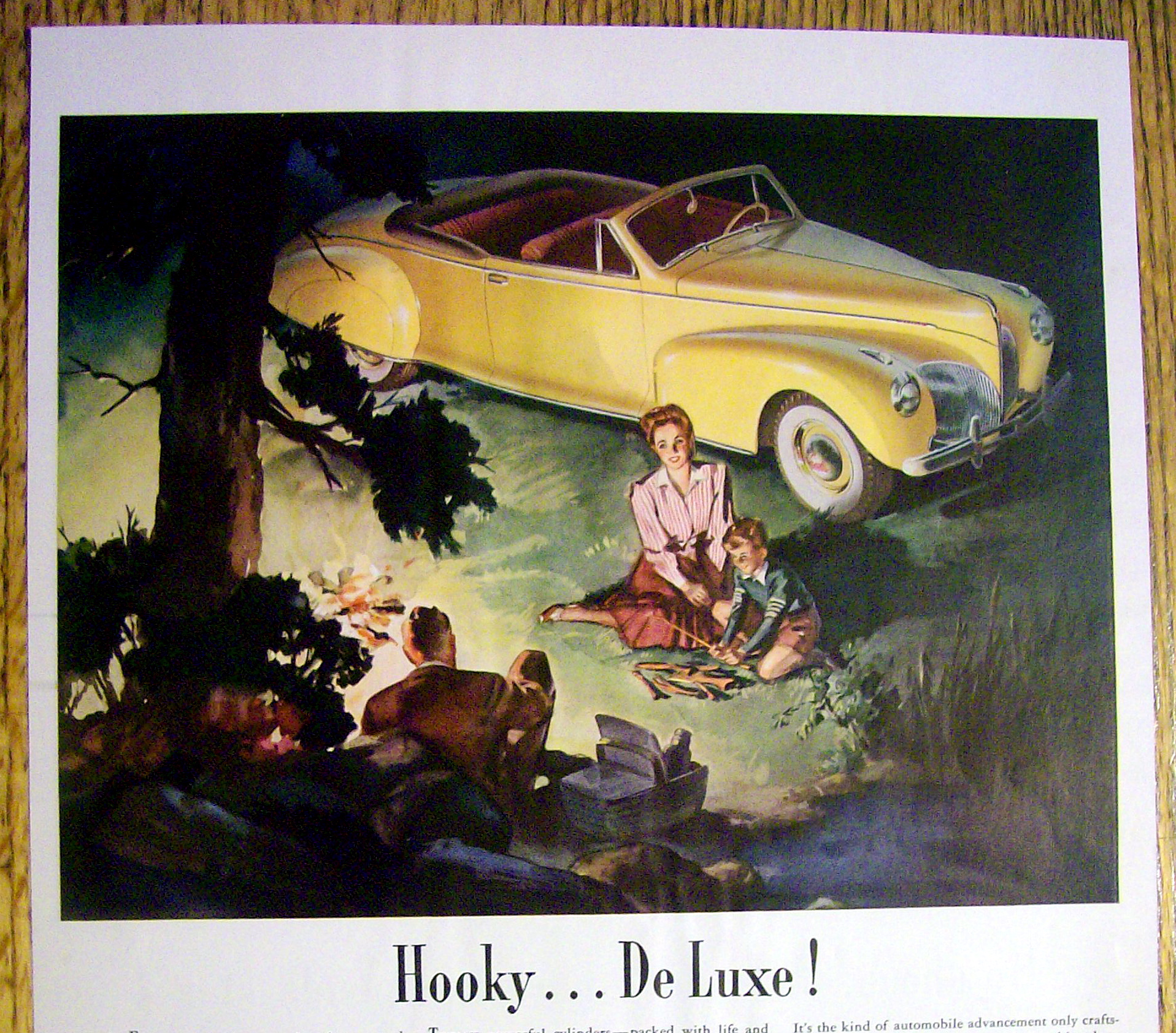 1941 Lincoln Zephyr V-12 with Family Sitting By a Fire