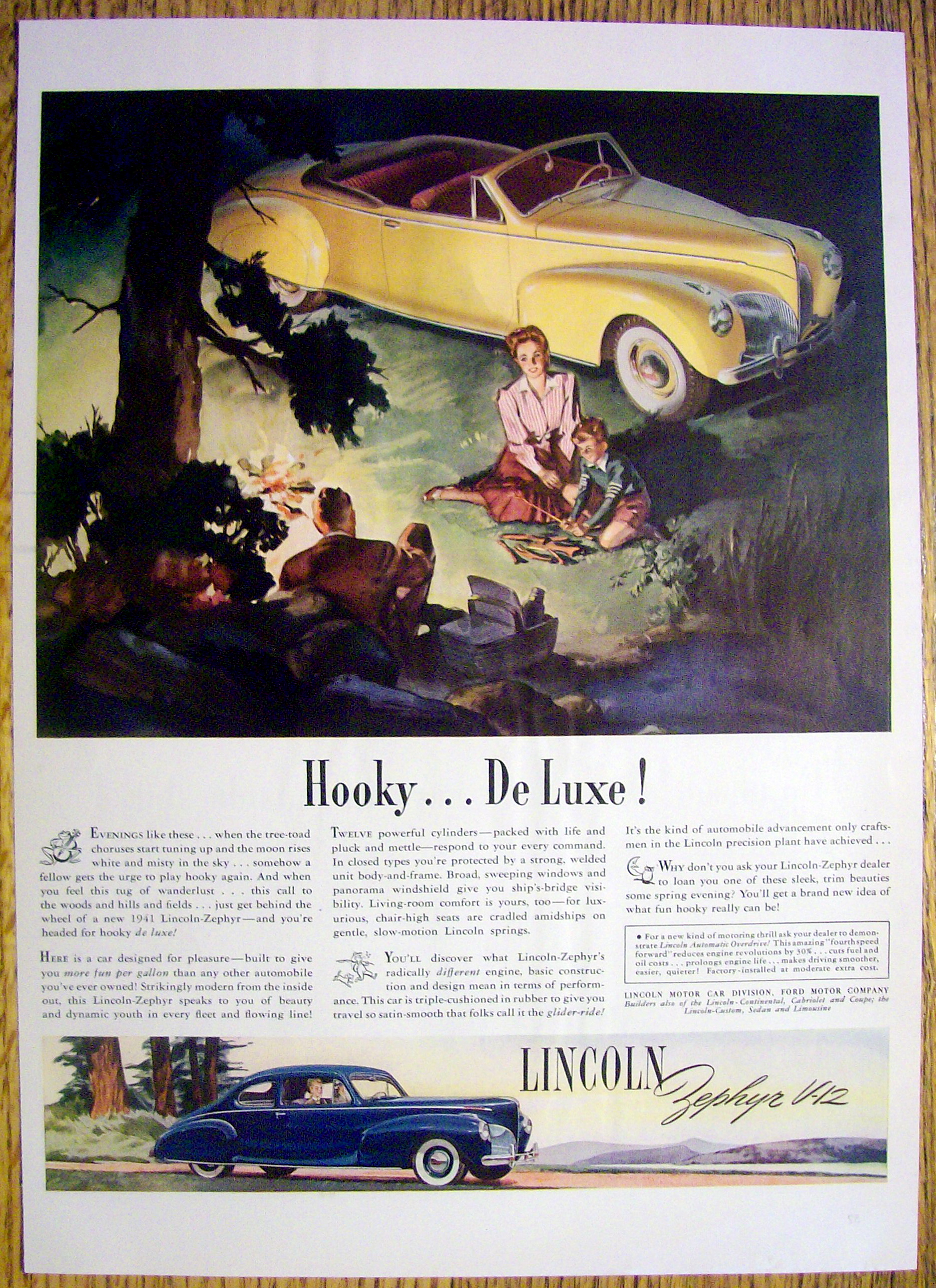 1941 Lincoln Zephyr V-12 with Family Sitting By a Fire