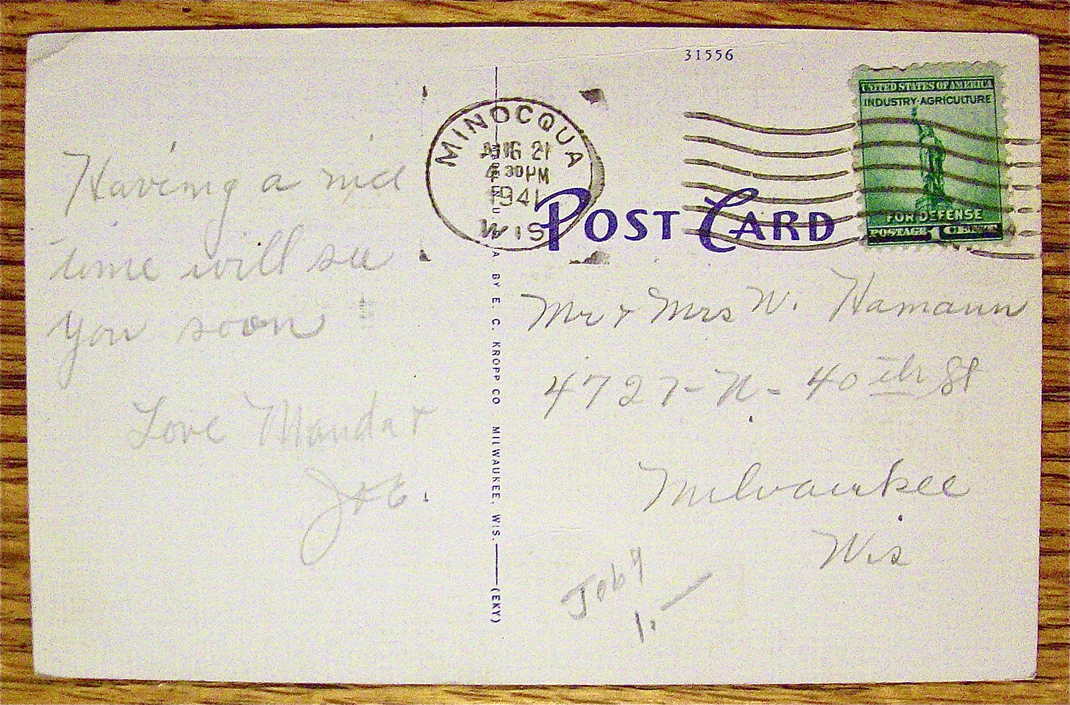 A Woman On Phone And Child Staring At Her Postcard