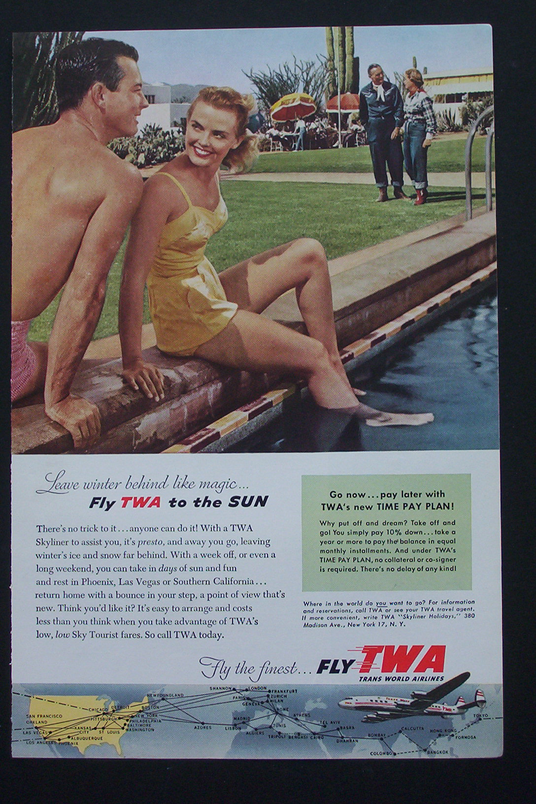 1954 Fly TWA with Couple Sitting By The Pool