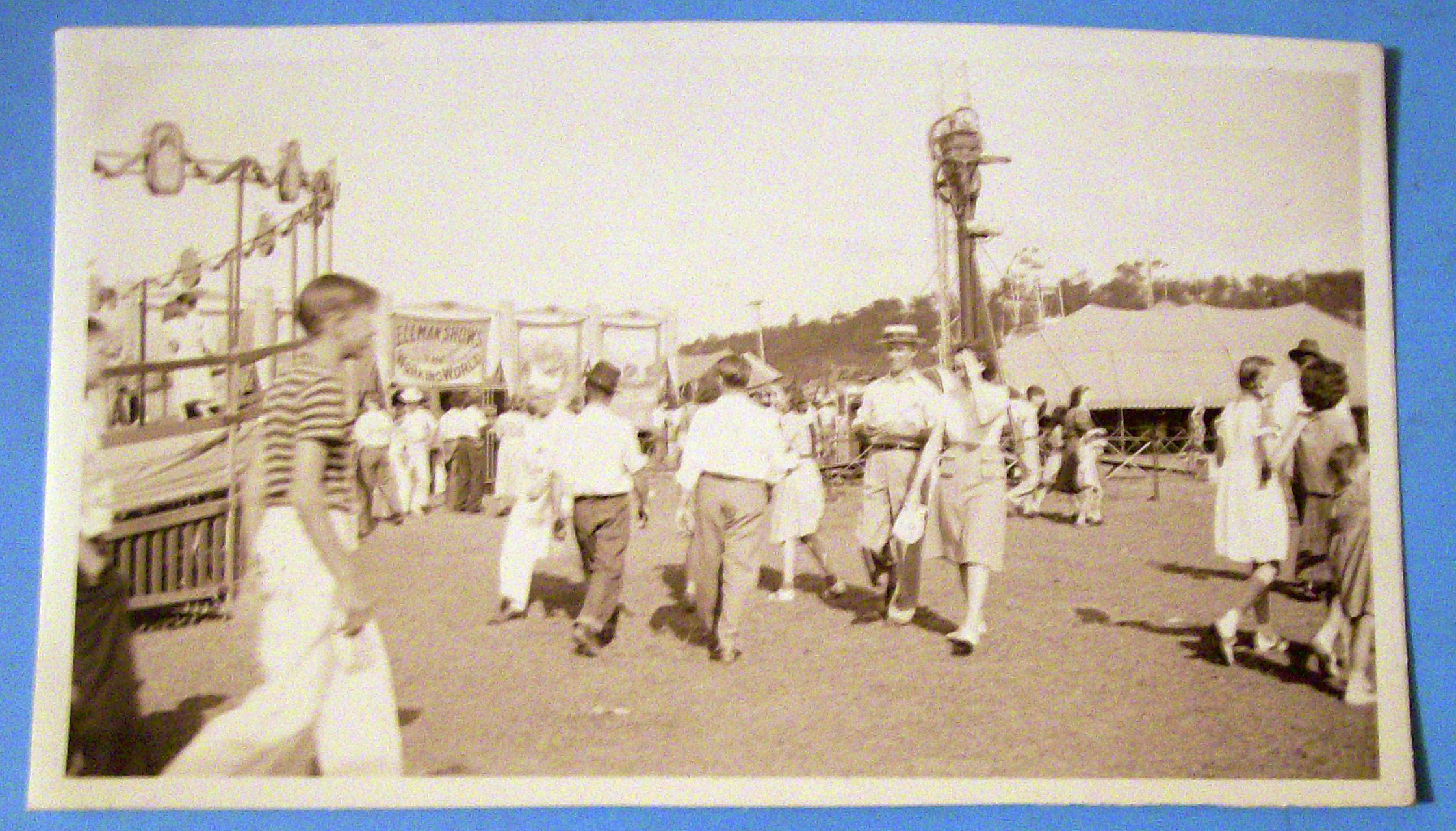 Photograph Of Carnival Scene with People Walking