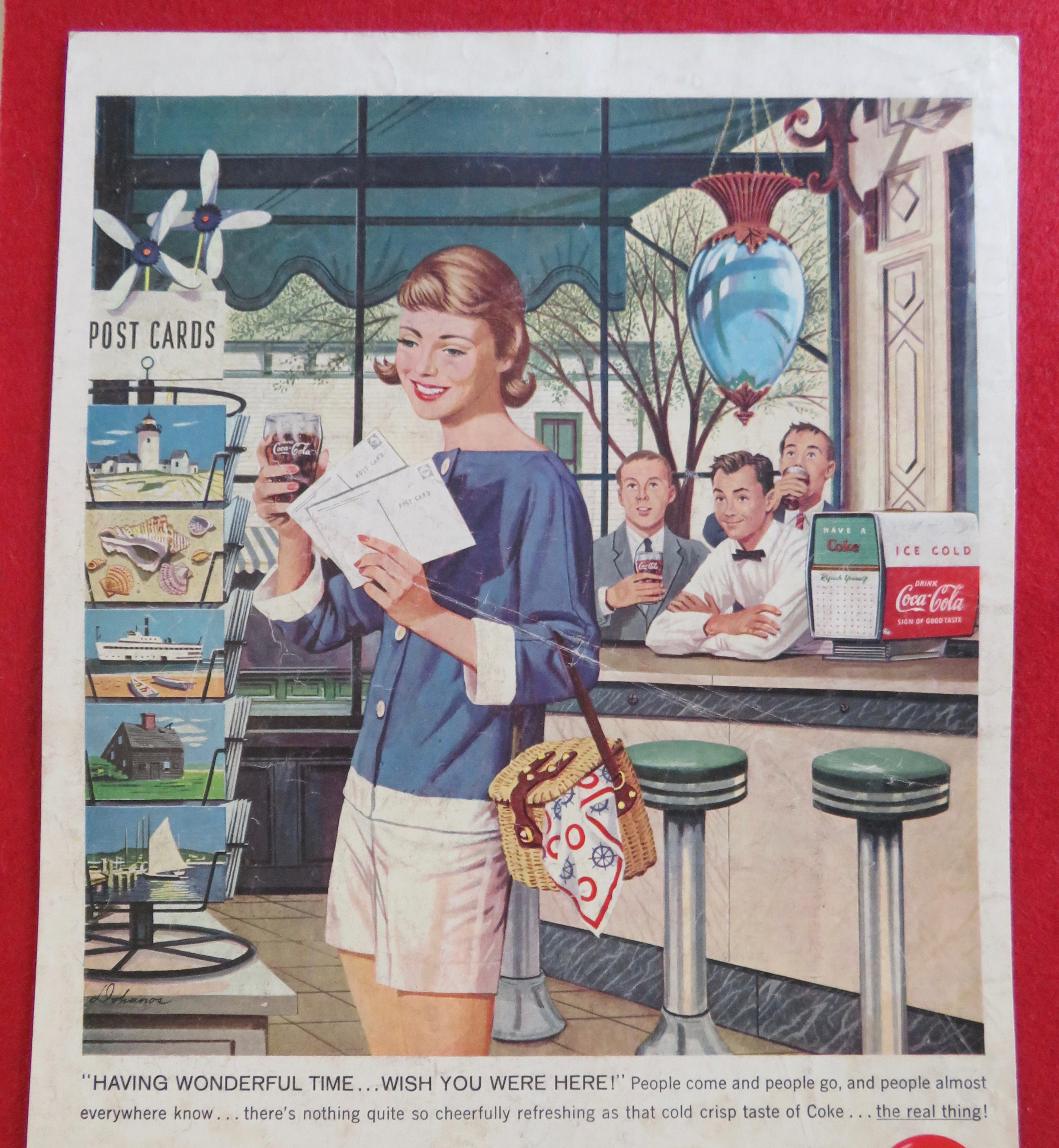 1958 Coca Cola (Coke) with Girl Looking at Postcards