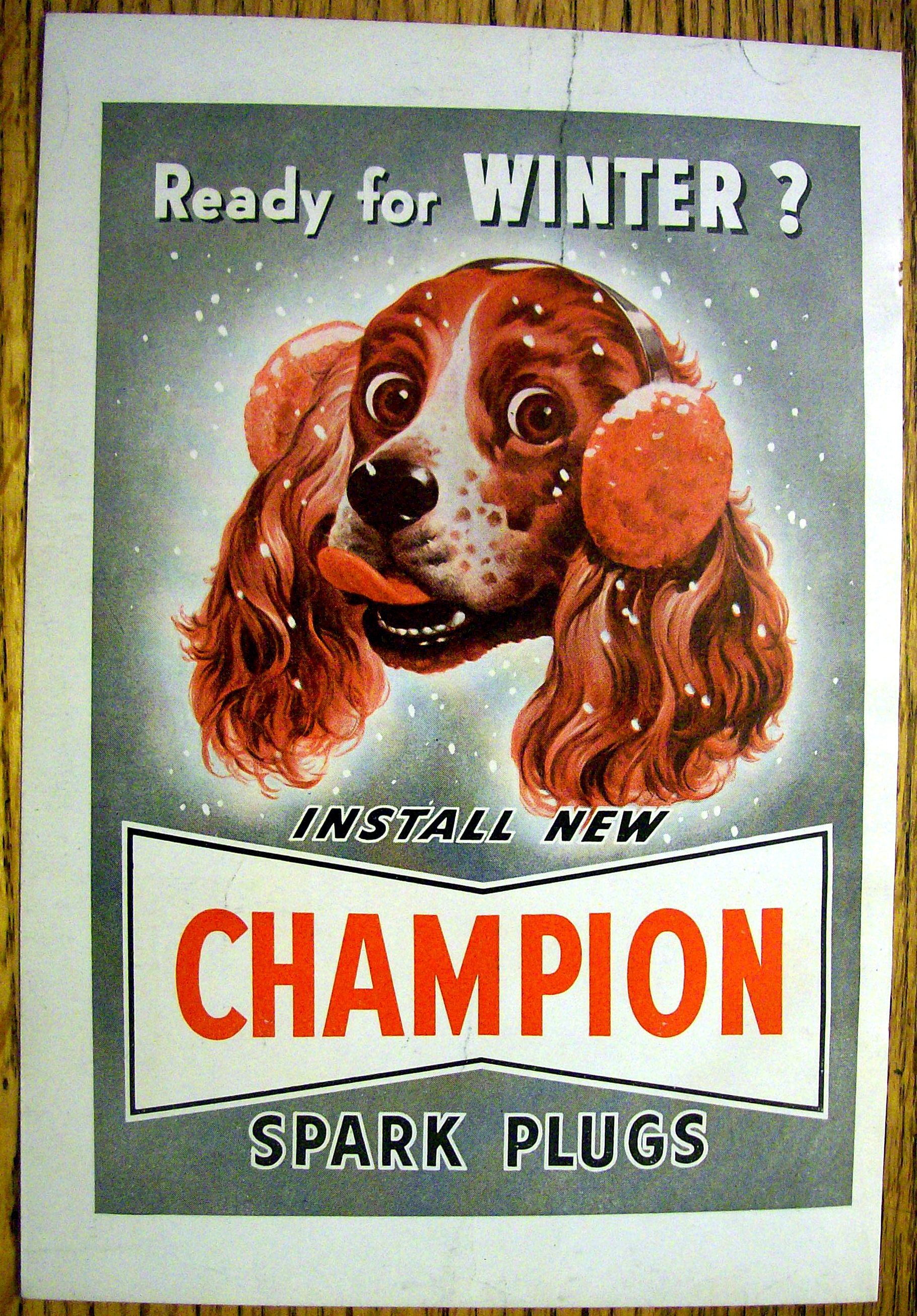 1949 Champion Spark Plugs with Dog Wearing Earmuffs