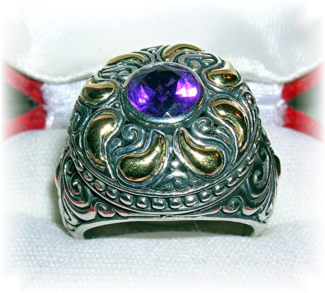 18 K GOLD and STERLING SILVER AMETHYST RING..