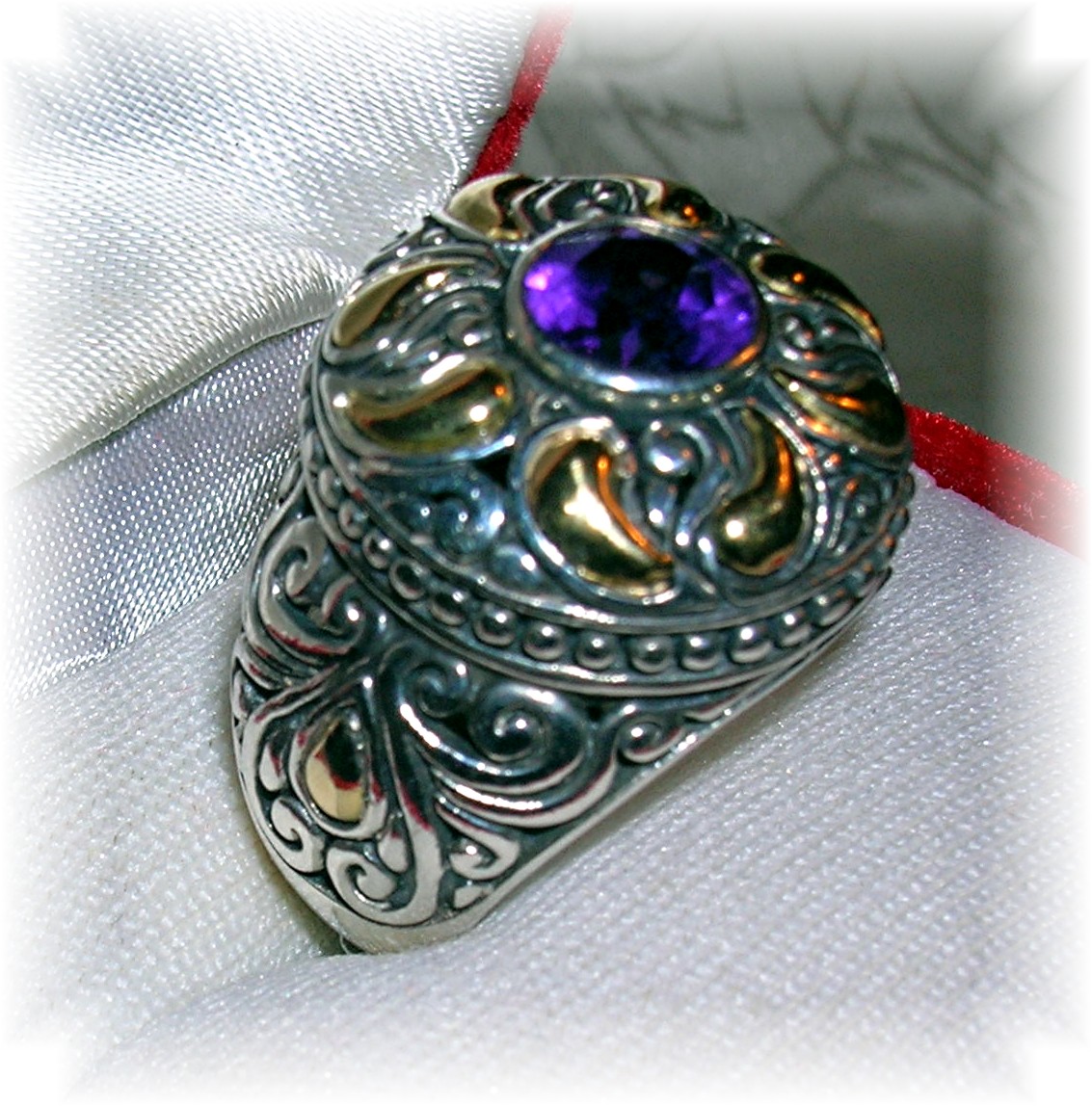 18 K GOLD and STERLING SILVER AMETHYST RING..