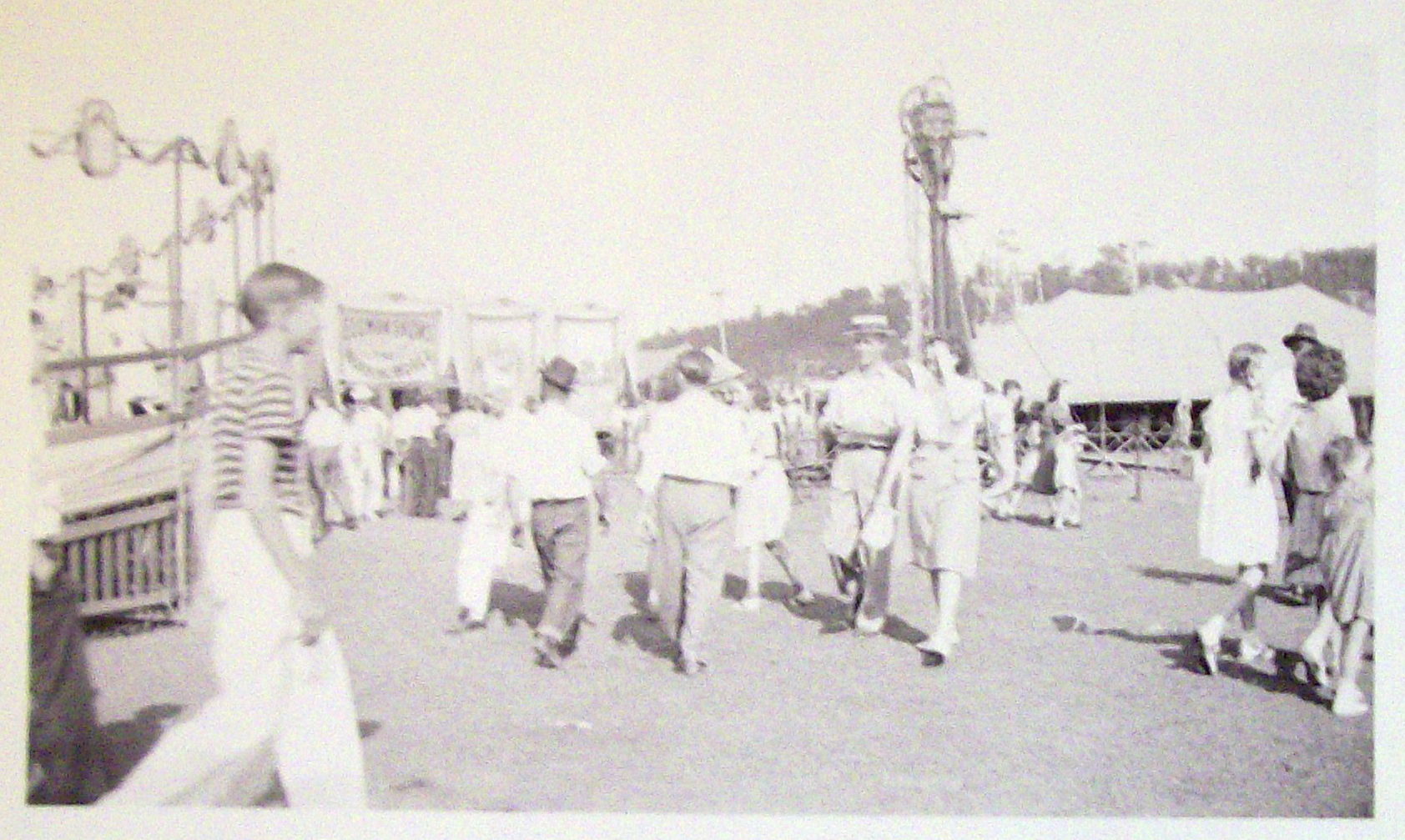 Photograph Of Carnival Scene with Assortment of Rides