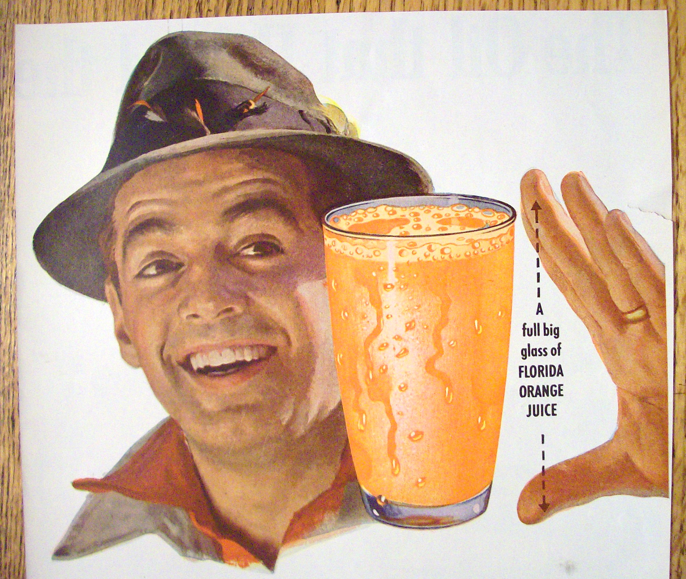 1953 Florida Oranges with Man Looking at Glass of Orange Juice