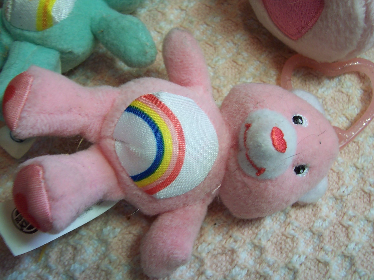 Care Bear Cheer Bear and two zipper pulls