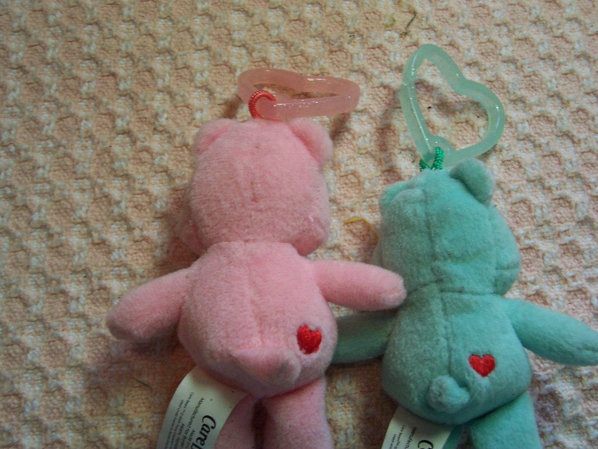 Care Bear Cheer Bear and two zipper pulls