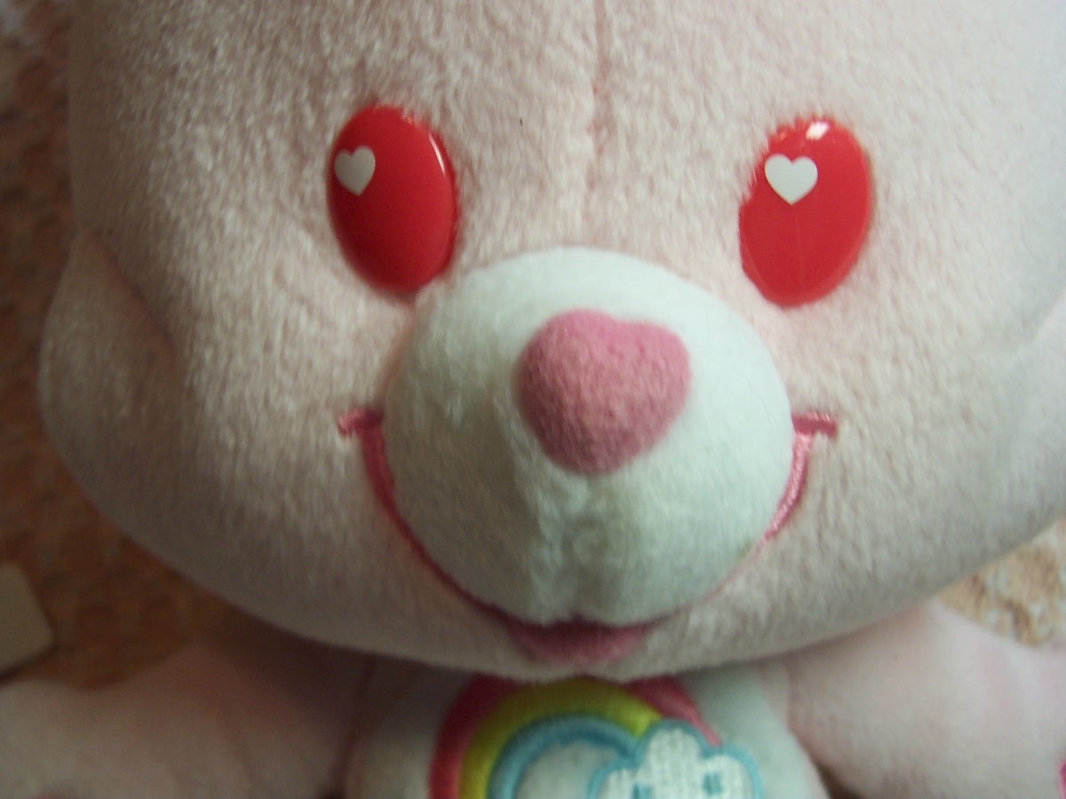 Care Bear Cheer Bear and two zipper pulls