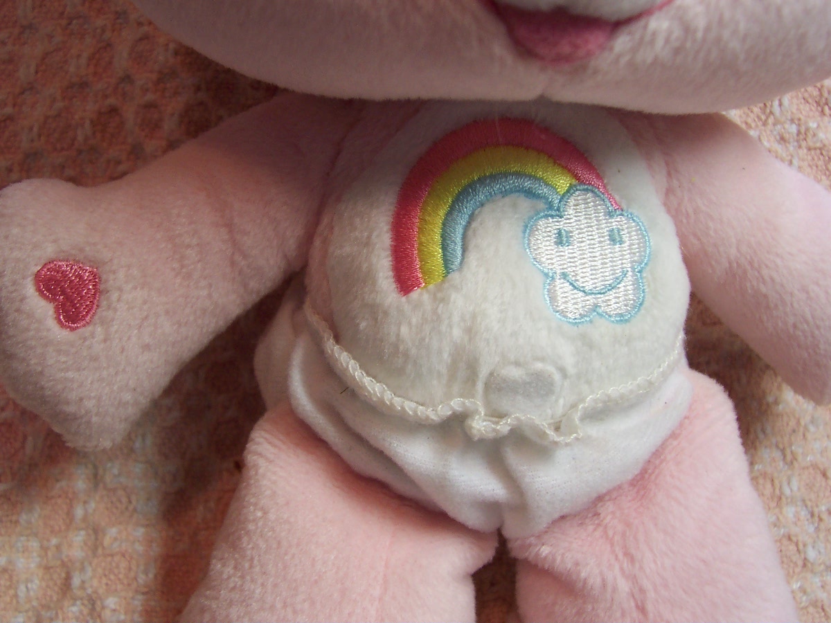 Care Bear Cheer Bear and two zipper pulls