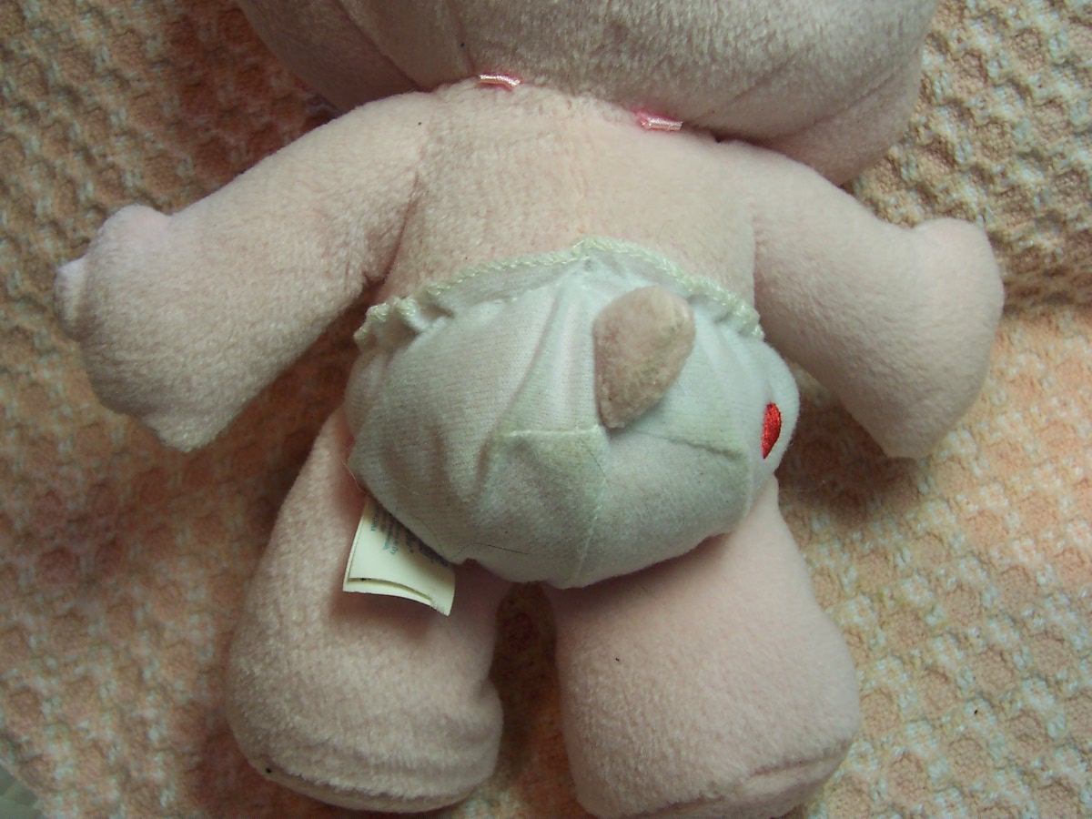 Care Bear Cheer Bear and two zipper pulls