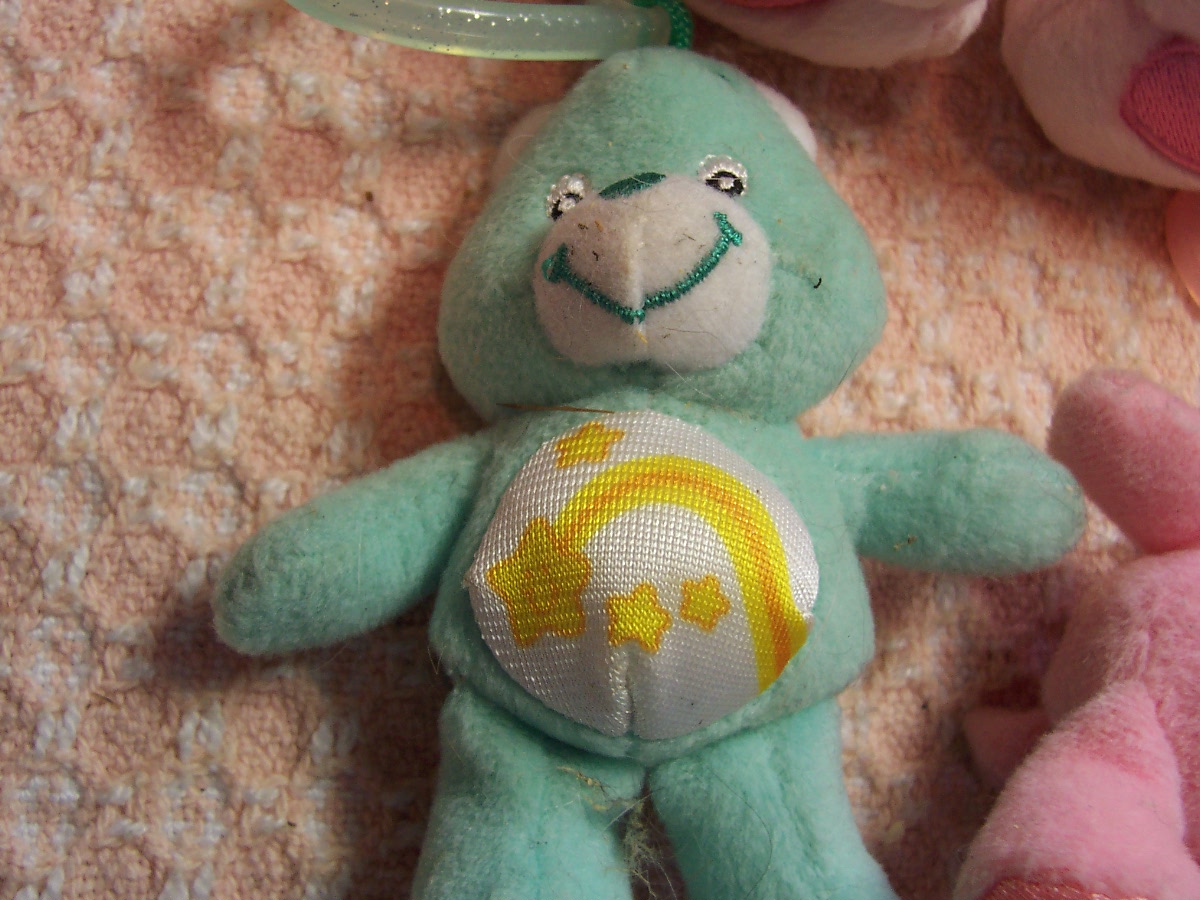 Care Bear Cheer Bear and two zipper pulls