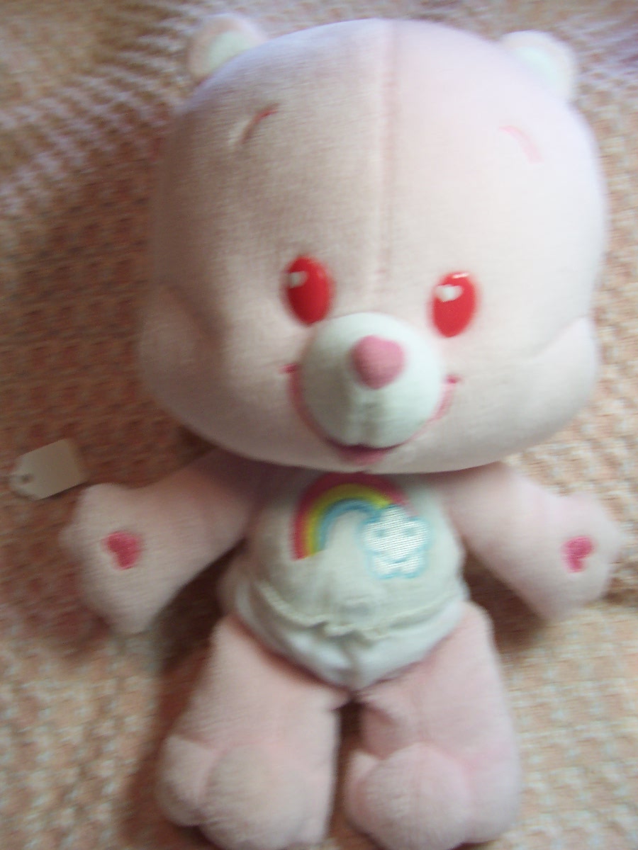 Care Bear Cheer Bear and two zipper pulls