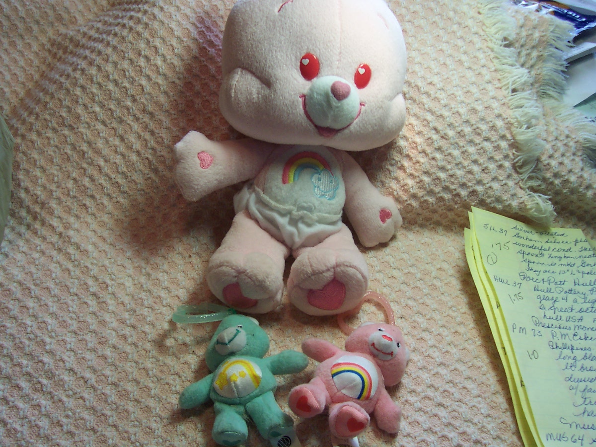 Care Bear Cheer Bear and two zipper pulls