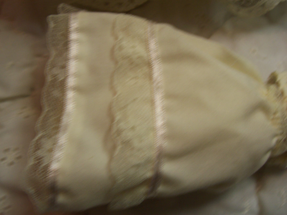 Porcelain Baby Doll in Wicker Carriage
