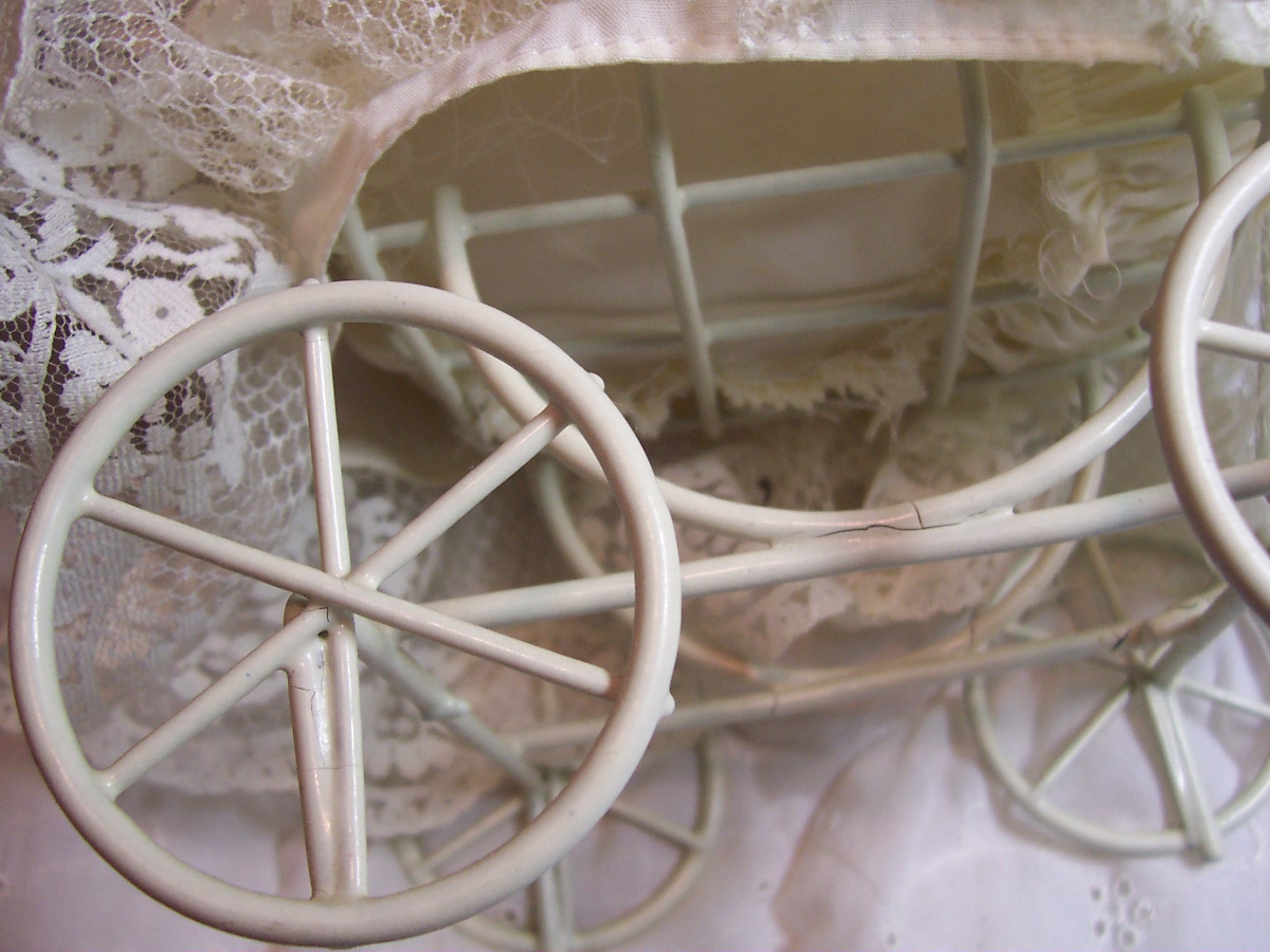 Porcelain Baby Doll in Wicker Carriage