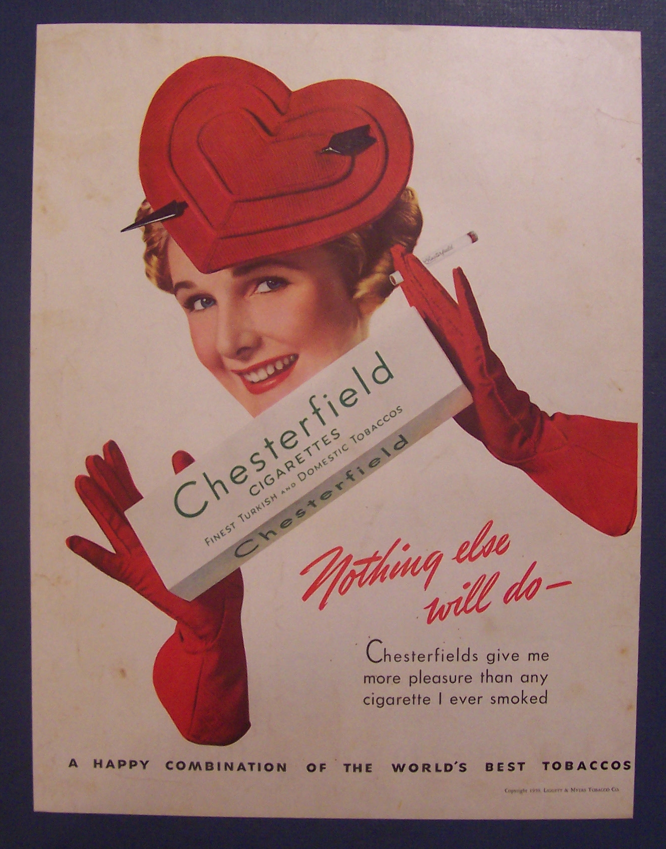 1939 Chesterfield Cigarettes w/Woman Holding Cigarettes