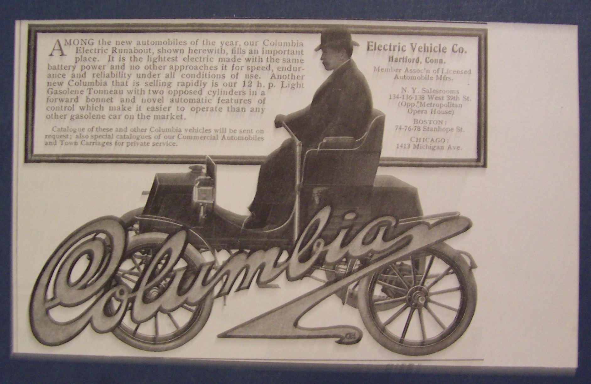 1904 Oldsmobile with a Man Driving