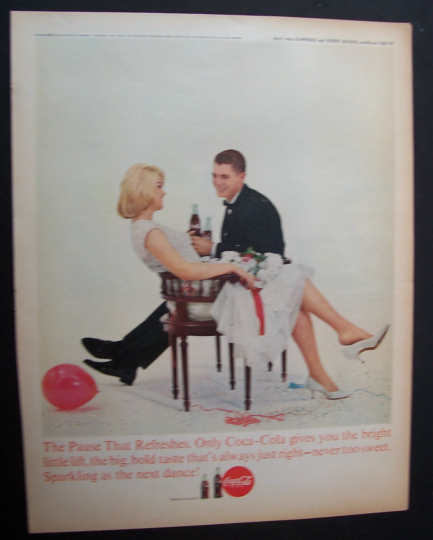 1963 Coca Cola (Coke) with a Man & Woman Sitting