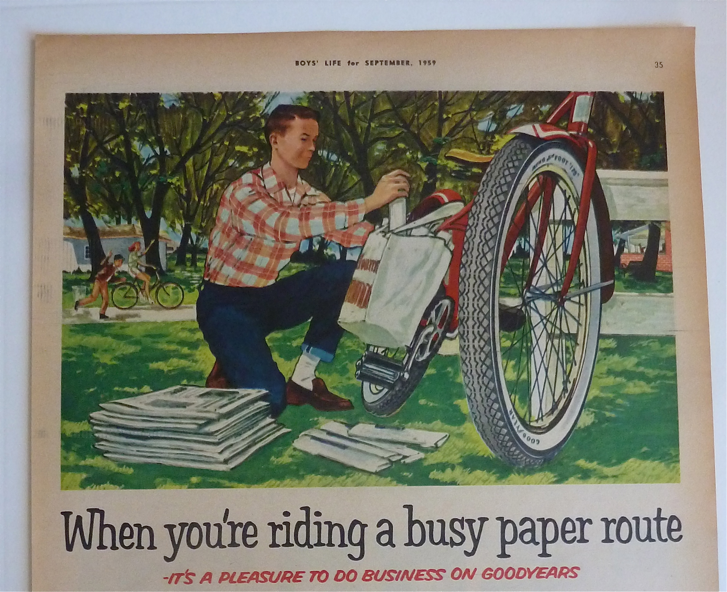 1959 Goodyear Tires with Boy Loading Papers On Bike