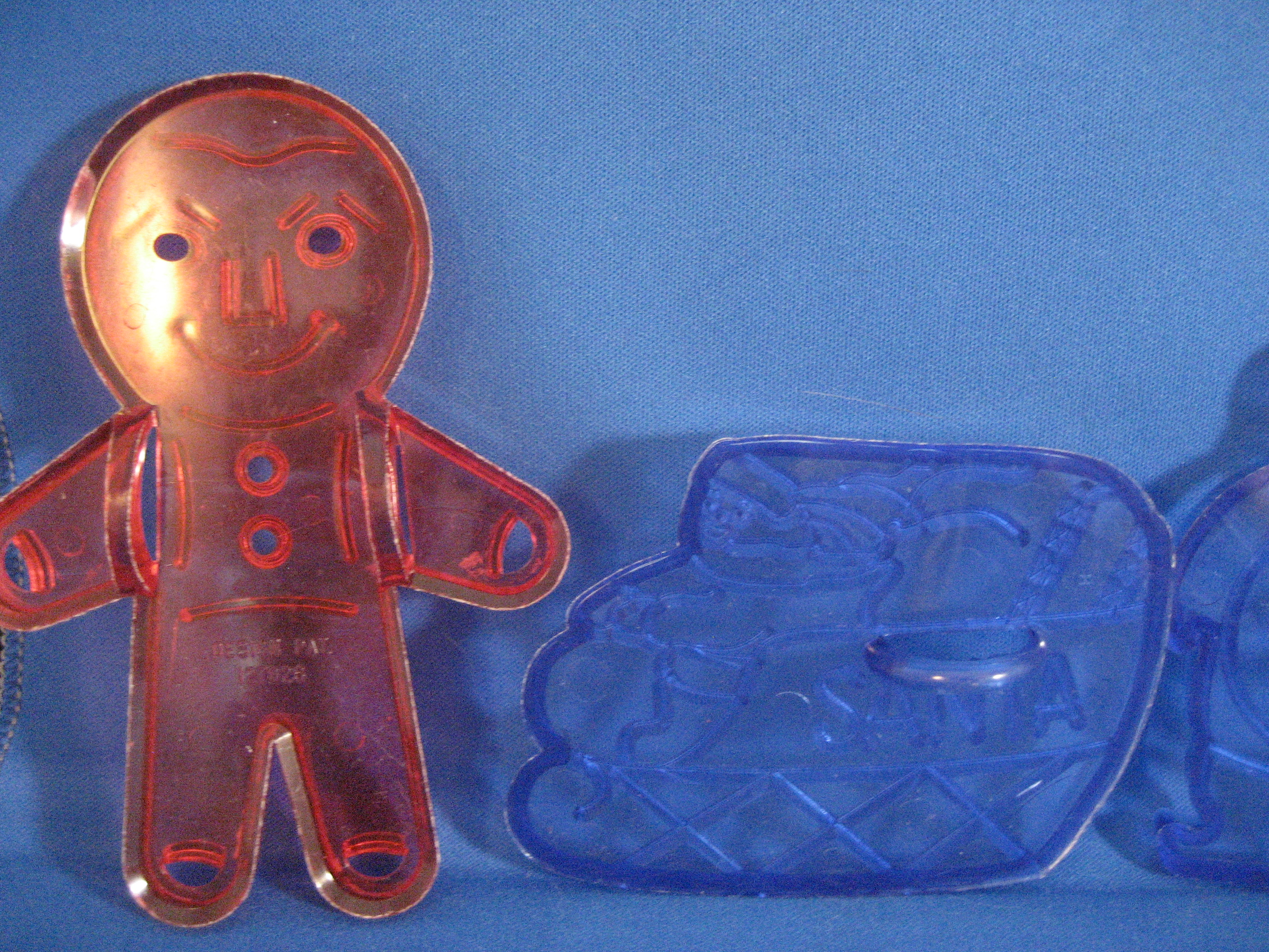 Four Plastic Christmas Cookie Cutters