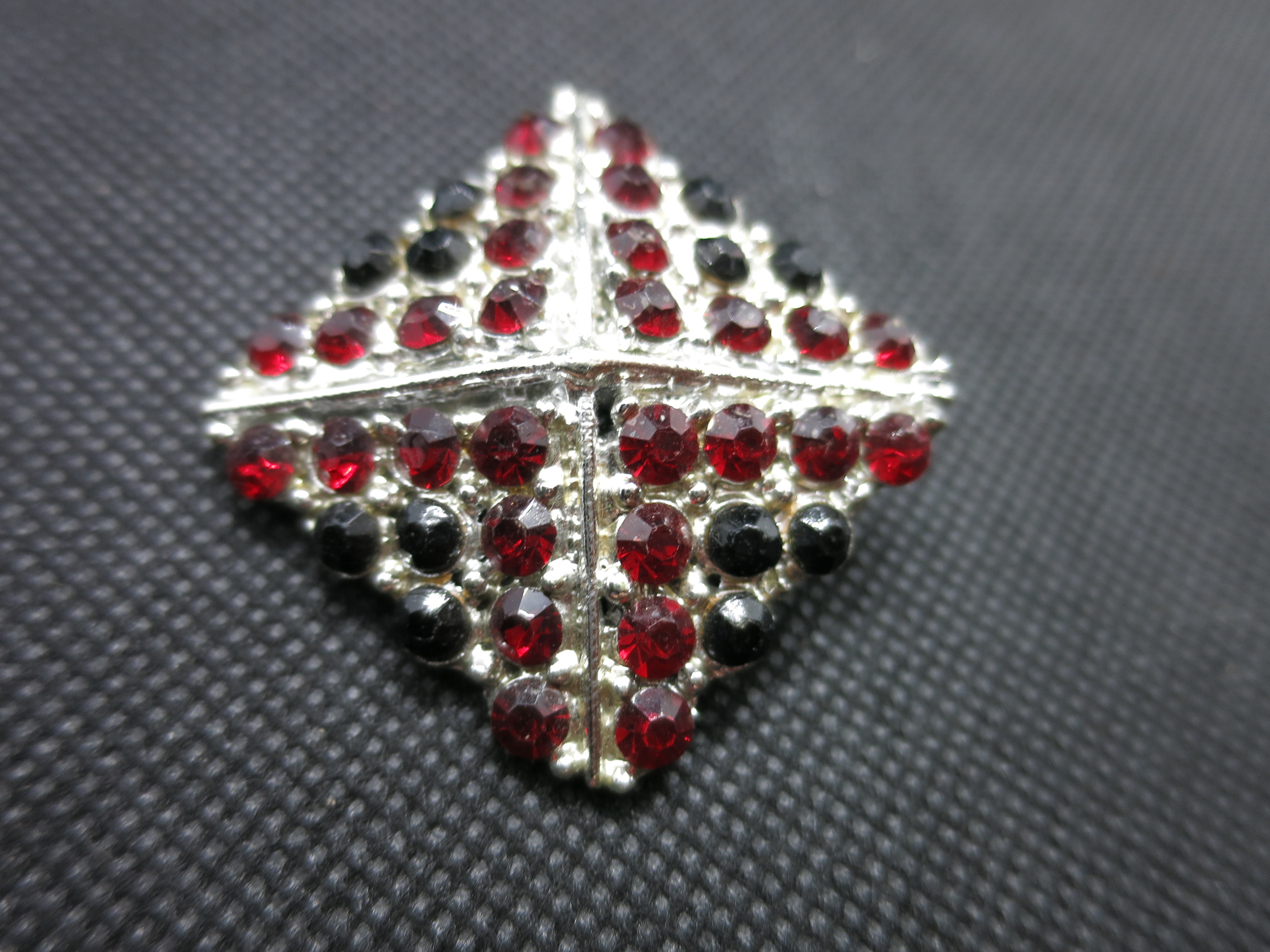 Vintage Silver Tone Brooch with red and black stones