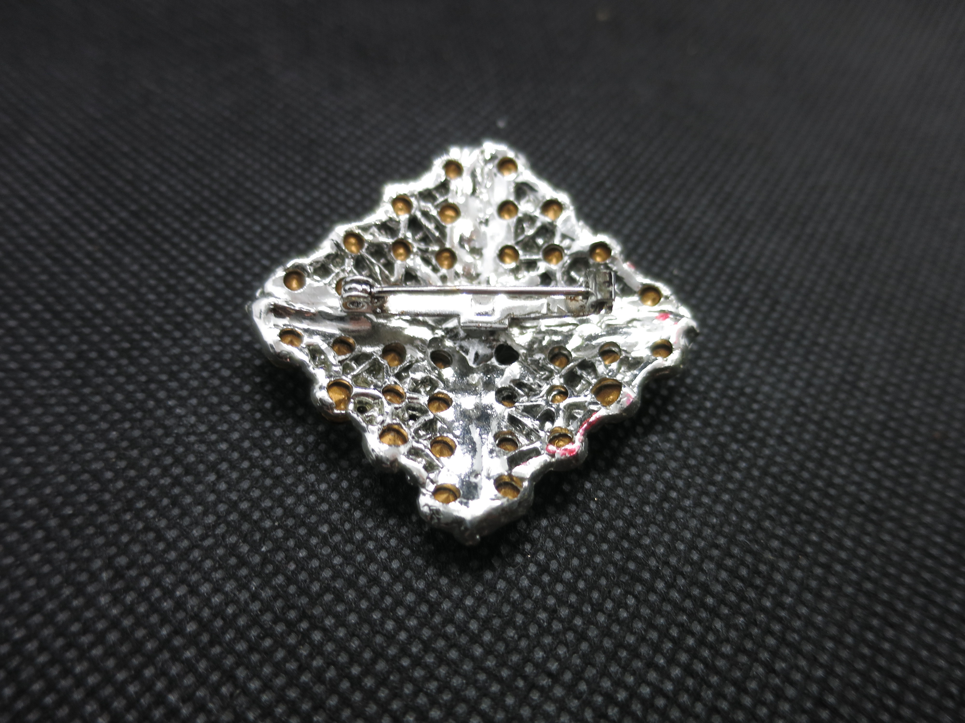 Vintage Silver Tone Brooch with red and black stones