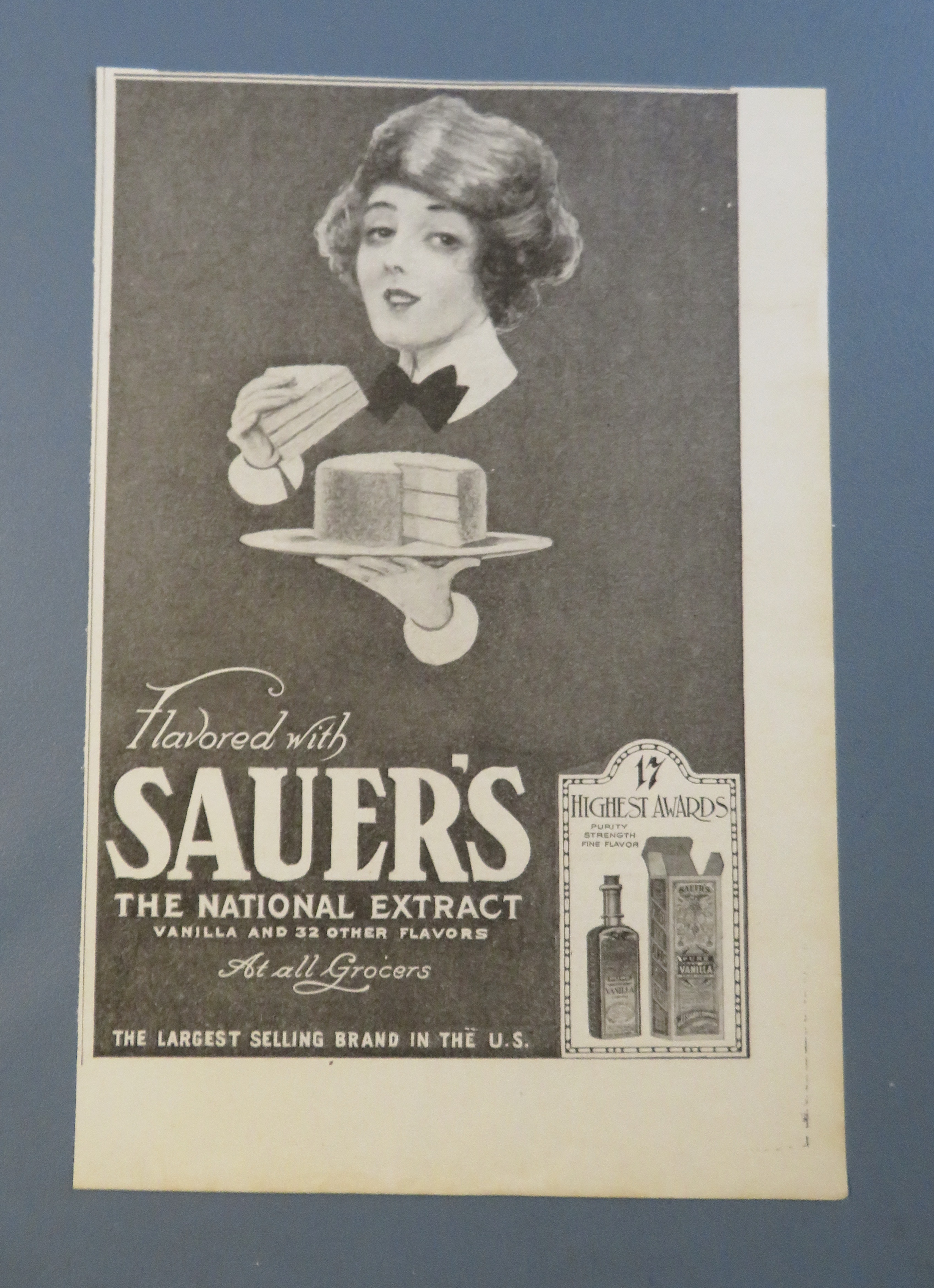 1920 Sauer National Extract with Woman Eating Cake