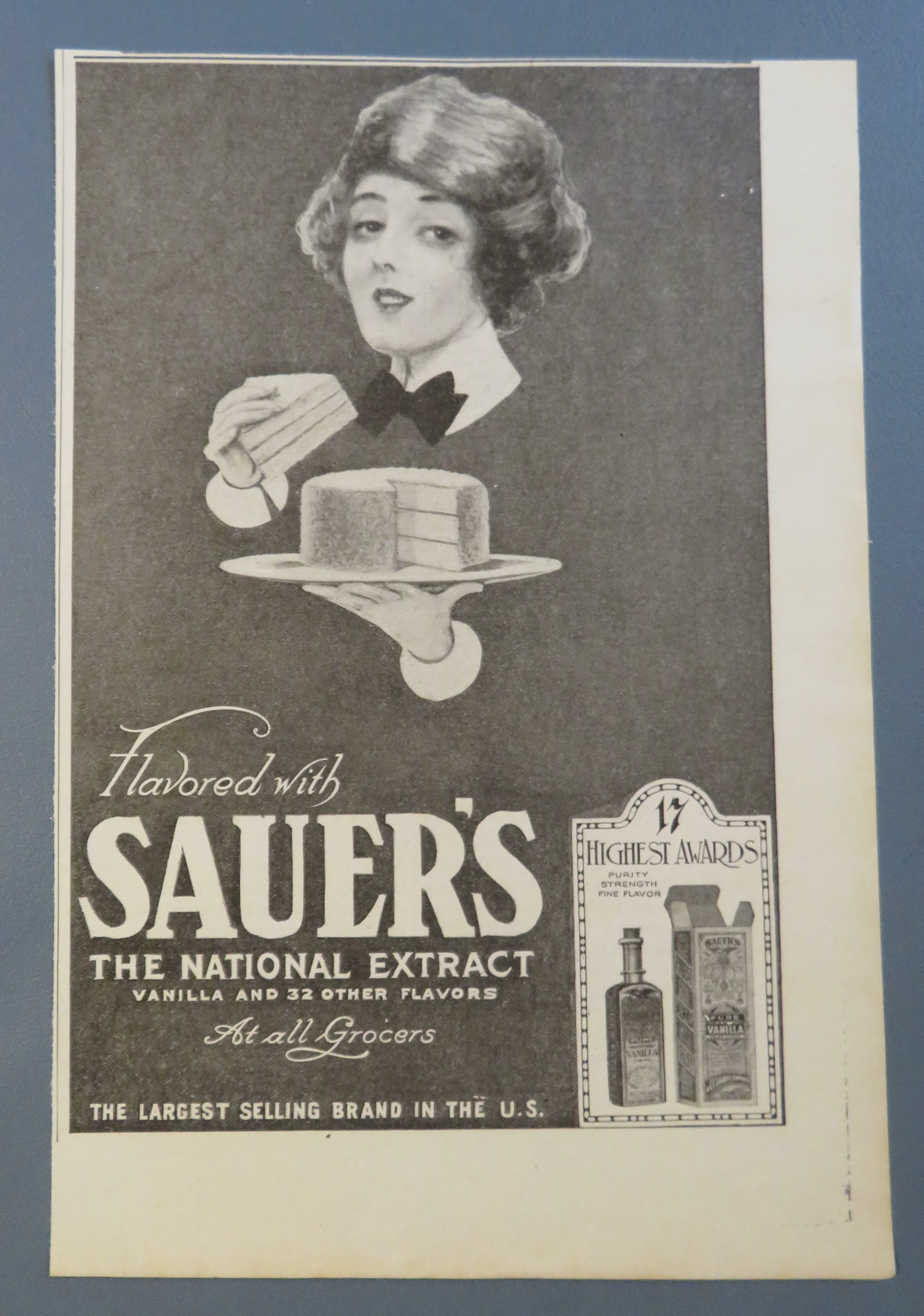1920 Sauer National Extract with Woman Eating Cake
